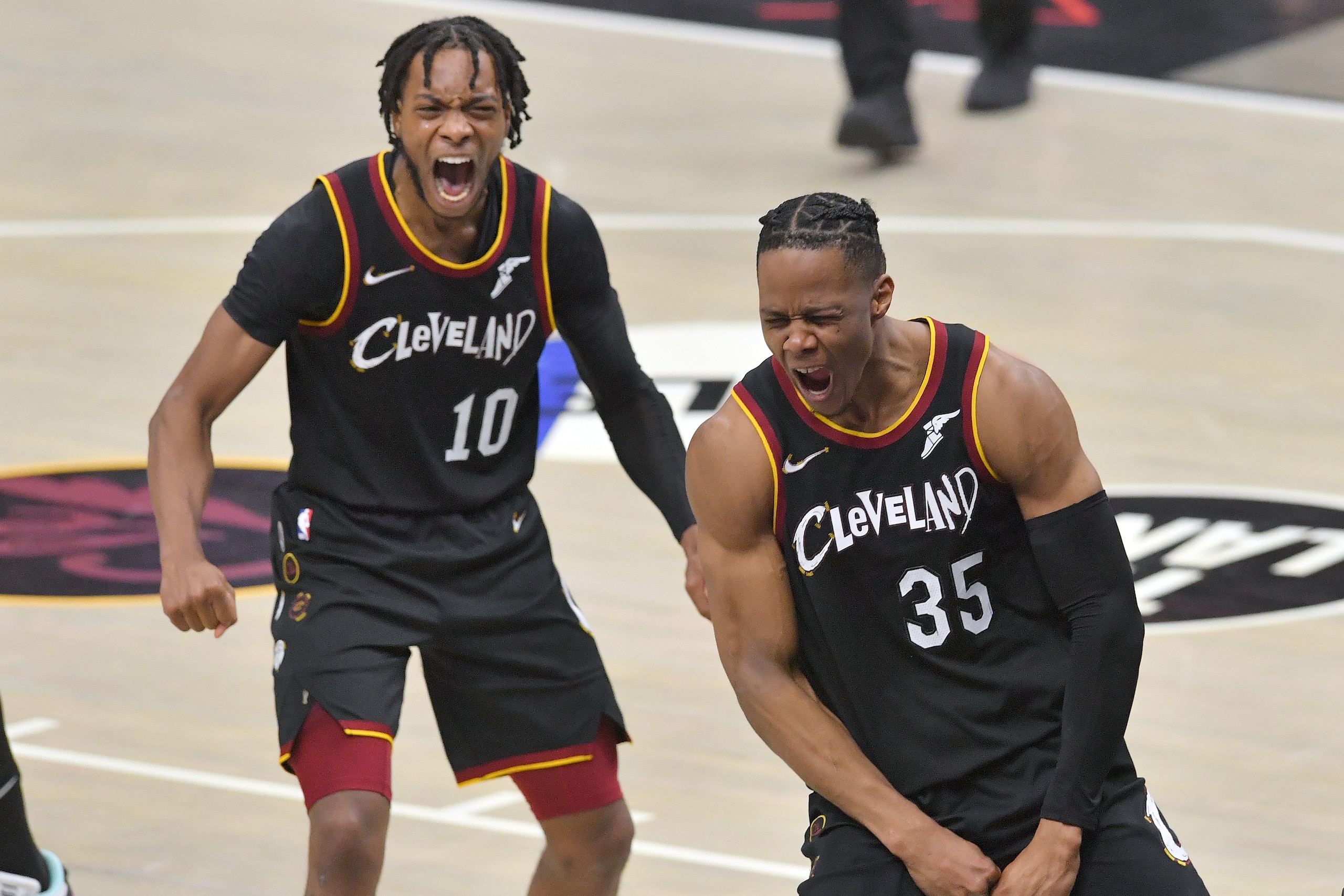 CLEVELAND, OHIO - MARCH 17: Darius Garland #10 and Isaac Okoro #35 of the Cleveland Cavaliers celebrate after Okoro scored during the fourth quarter against the Boston Celtics at Rocket Mortgage Fieldhouse on March 17, 2021 in Cleveland, Ohio. NOTE TO USE