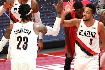 PORTLAND, OREGON - JANUARY 11: Robert Covington #23 and CJ McCollum #3 of the Portland Trail Blazers celebrate their 112-111 win against the Toronto Raptors at Moda Center on January 11, 2021 in Portland, Oregon. NOTE TO USER: User expressly acknowledges 