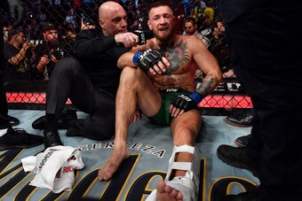 LAS VEGAS, NEVADA - JULY 10: Conor McGregor of Ireland is interviewed by Joe Rogan after his TKO loss due to injury against Dustin Poirier in their welterweight fight during the UFC 264 event at T-Mobile Arena on July 10, 2021 in Las Vegas, Nevada. (Photo