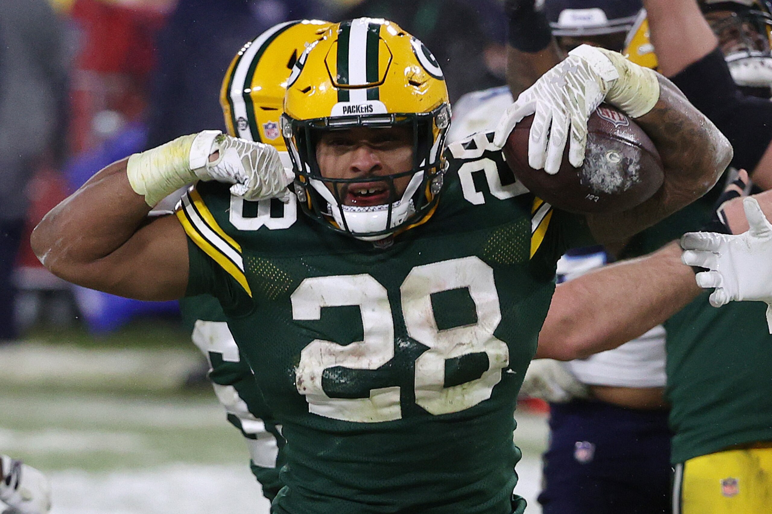 GREEN BAY, WISCONSIN - DECEMBER 27: A.J. Dillon #28 of the Green Bay Packers celebrates a touchdown against the Tennessee Titans during the fourth quarter at Lambeau Field on December 27, 2020 in Green Bay, Wisconsin. (Photo by Dylan Buell/Getty Images)