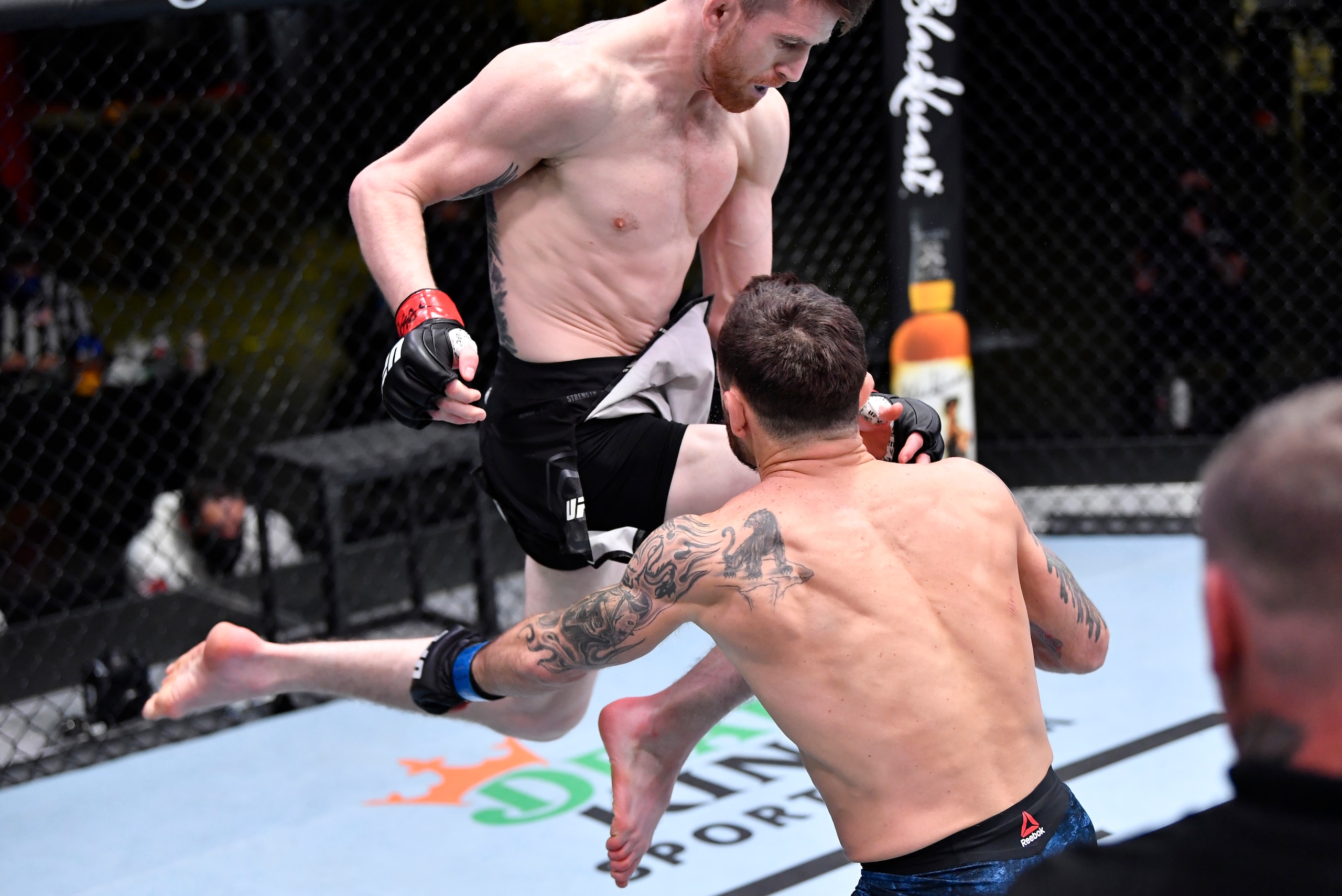 LAS VEGAS, NEVADA - FEBRUARY 06: In this handout image provided by UFC, Cory Sandhagen lands a flying knee to knock out Frankie Edgar in their bantamweight fight during the UFC Fight Night event at UFC APEX on February 06, 2021 in Las Vegas, Nevada. (Phot