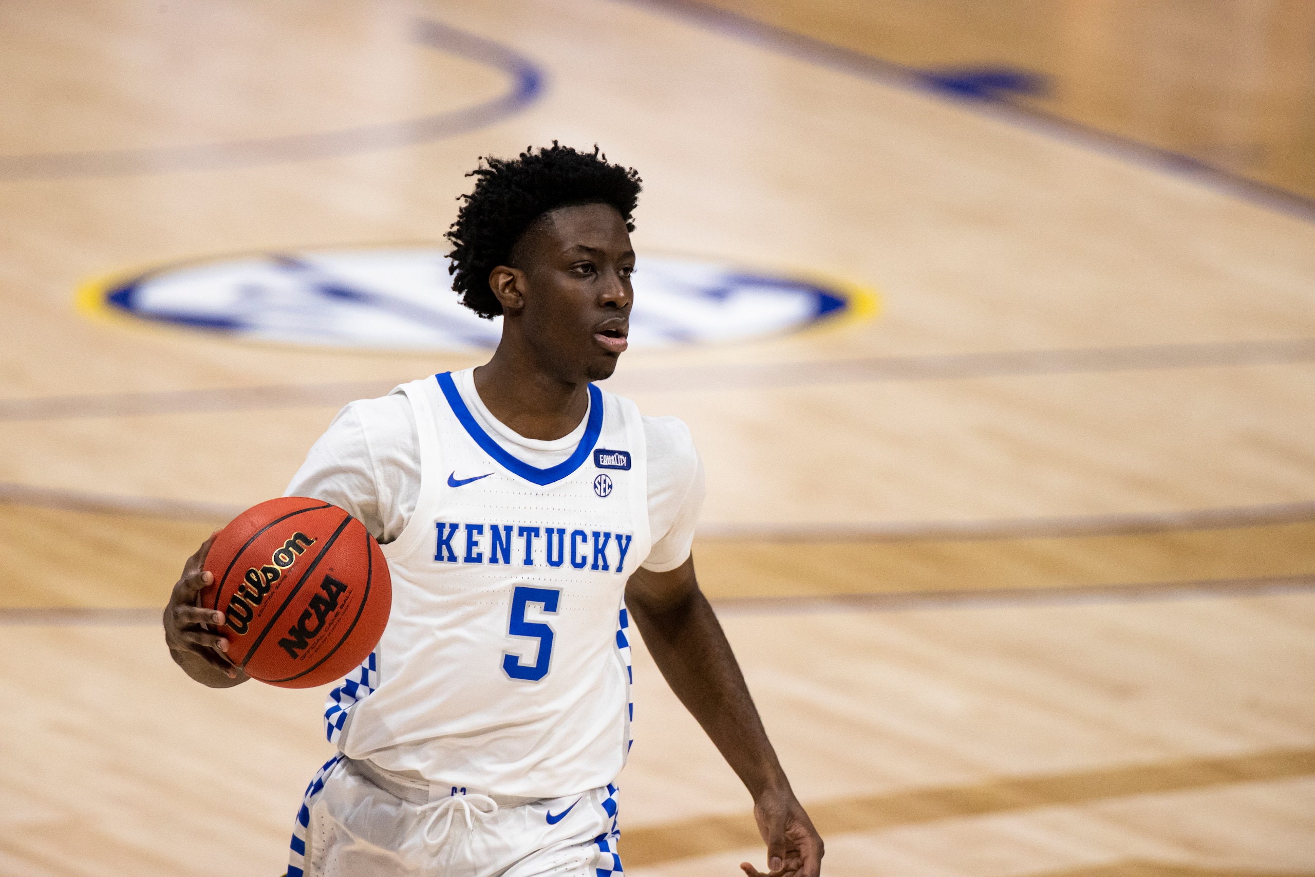 NASHVILLE, TN - MARCH 11:  Terrence Clarke #5 of the Kentucky Wildcats dribbles the ball at half court against the Mississippi State Bulldogs during the first half of their second round game in the SEC Men's Basketball Tournament at Bridgestone Arena on M
