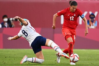 Sinclair being challenged by the United States' Julie Ertz during the semifinal.