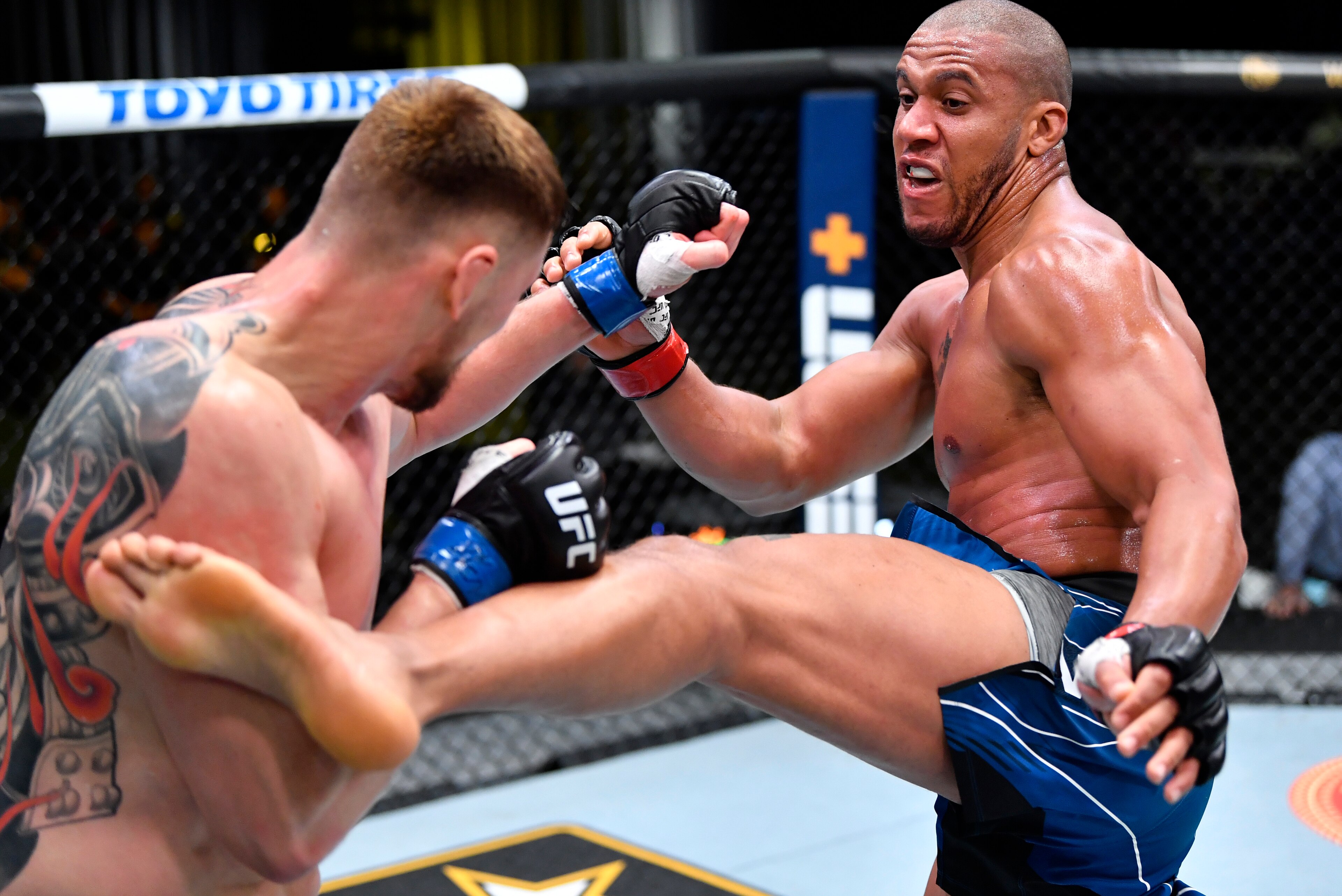 LAS VEGAS, NEVADA - JUNE 26: In this handout photo provided by UFC, (R-L) Ciryl Gane of France kicks Alexander Volkov of Russia in a heavyweight fight during the UFC Fight Night event at UFC APEX on June 26, 2021 in Las Vegas, Nevada. (Photo by Chris Unge