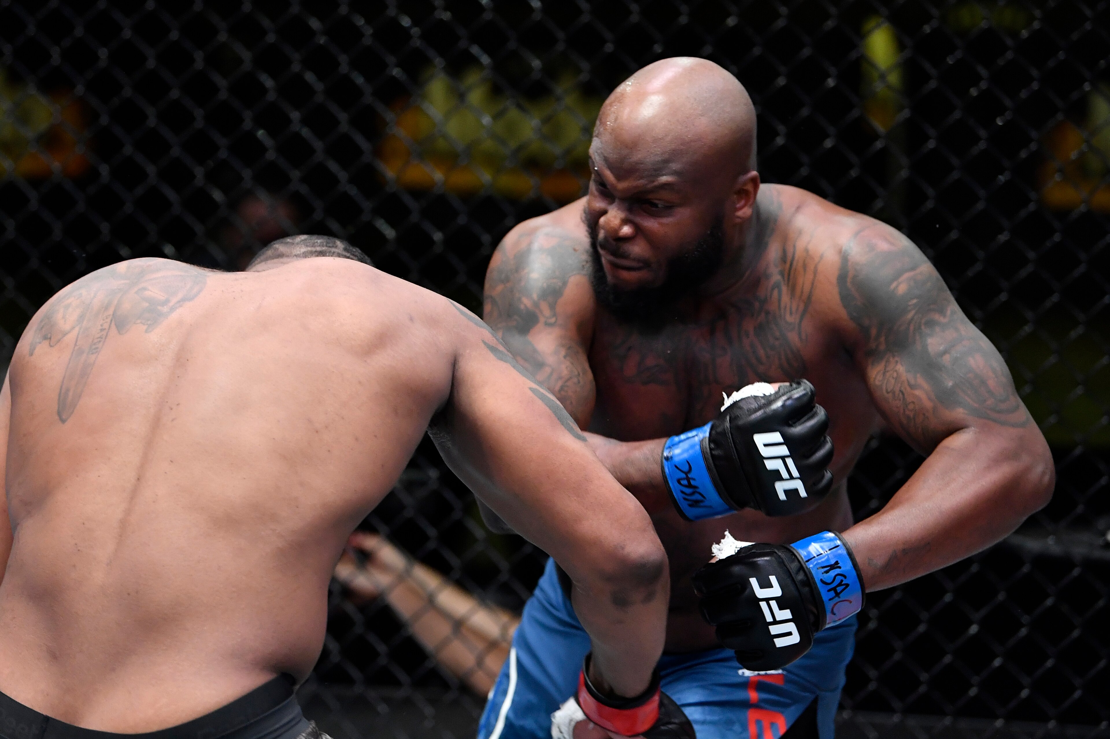 LAS VEGAS, NEVADA - FEBRUARY 20: (R-L) Derrick Lewis punches Curtis Blaydes in a heavyweight bout during the UFC Fight Night event at UFC APEX on February 20, 2021 in Las Vegas, Nevada. (Photo by Chris Unger/Zuffa LLC)