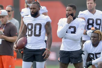 BEREA, OHIO - JULY 30: Wide receiver Jarvis Landry #80 and wide receiver Odell Beckham Jr. #13 of the Cleveland Browns watch from the sidelines during Cleveland Browns Training Camp on July 30, 2021 in Berea, Ohio. (Photo by Jason Miller/Getty Images)