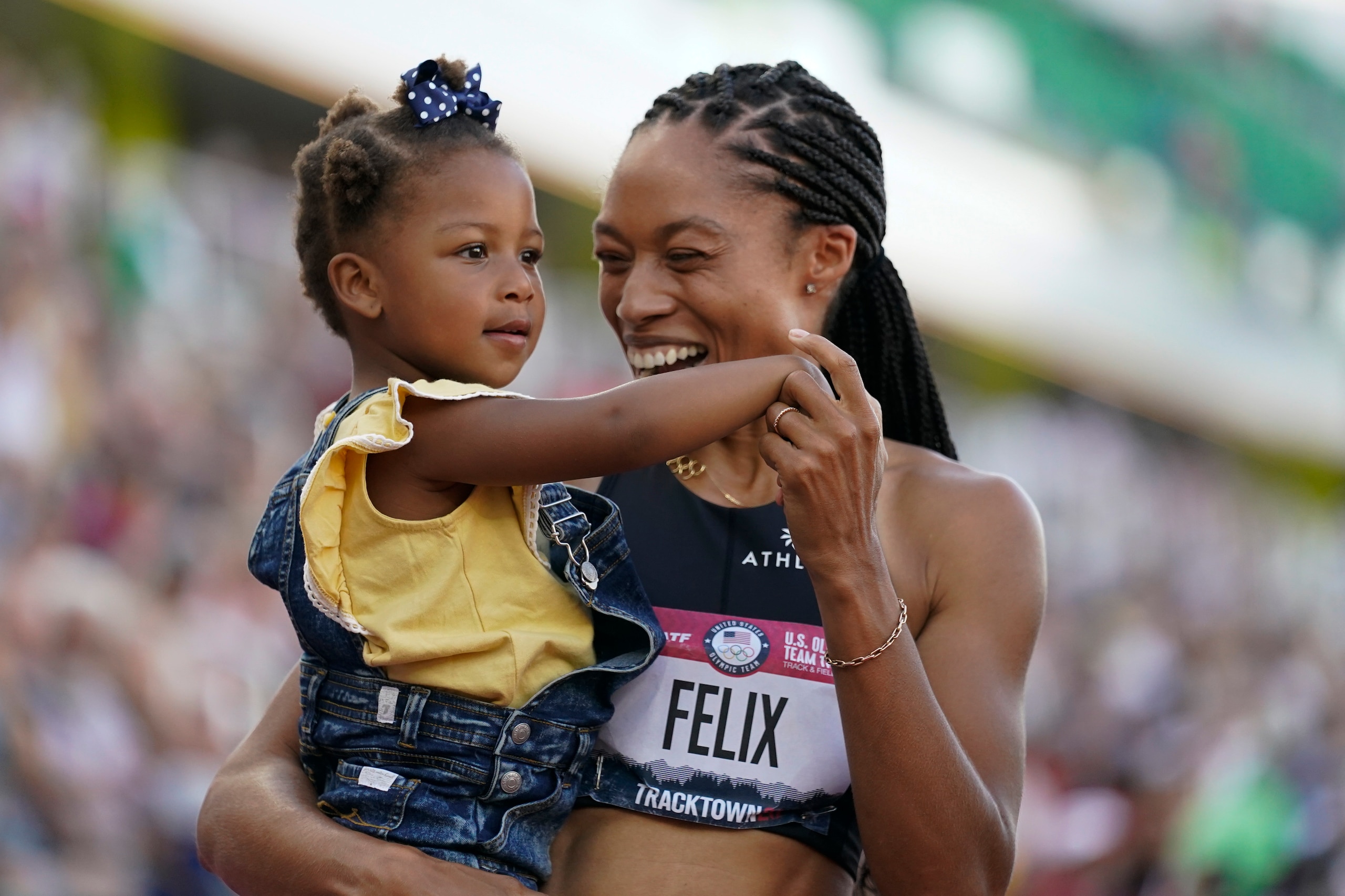 Felix holds her daughter, Camryn, at the U.S. Olympic trials in June.
