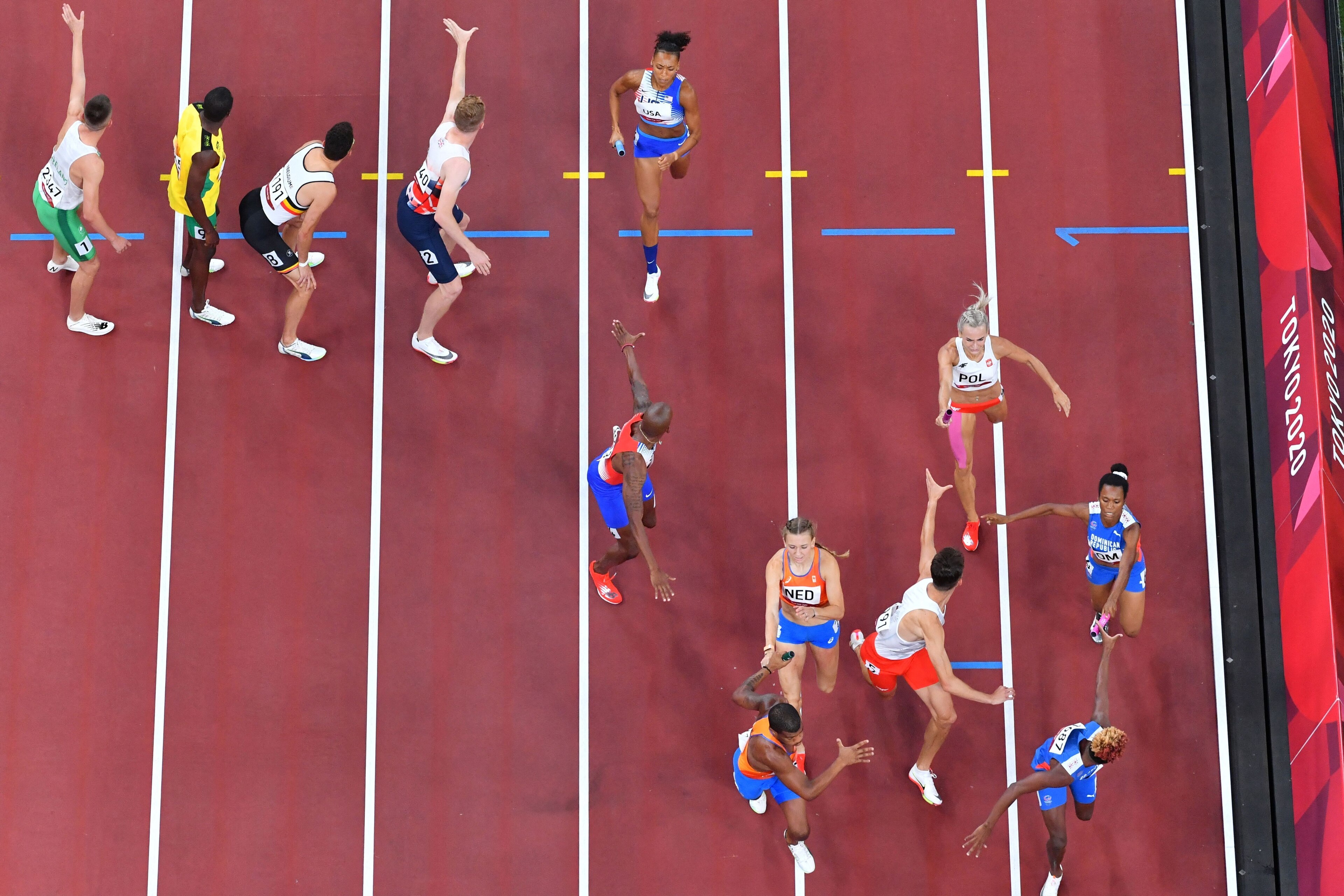 Runners hand off batons during the mixed 4x400-meter relay in Tokyo.