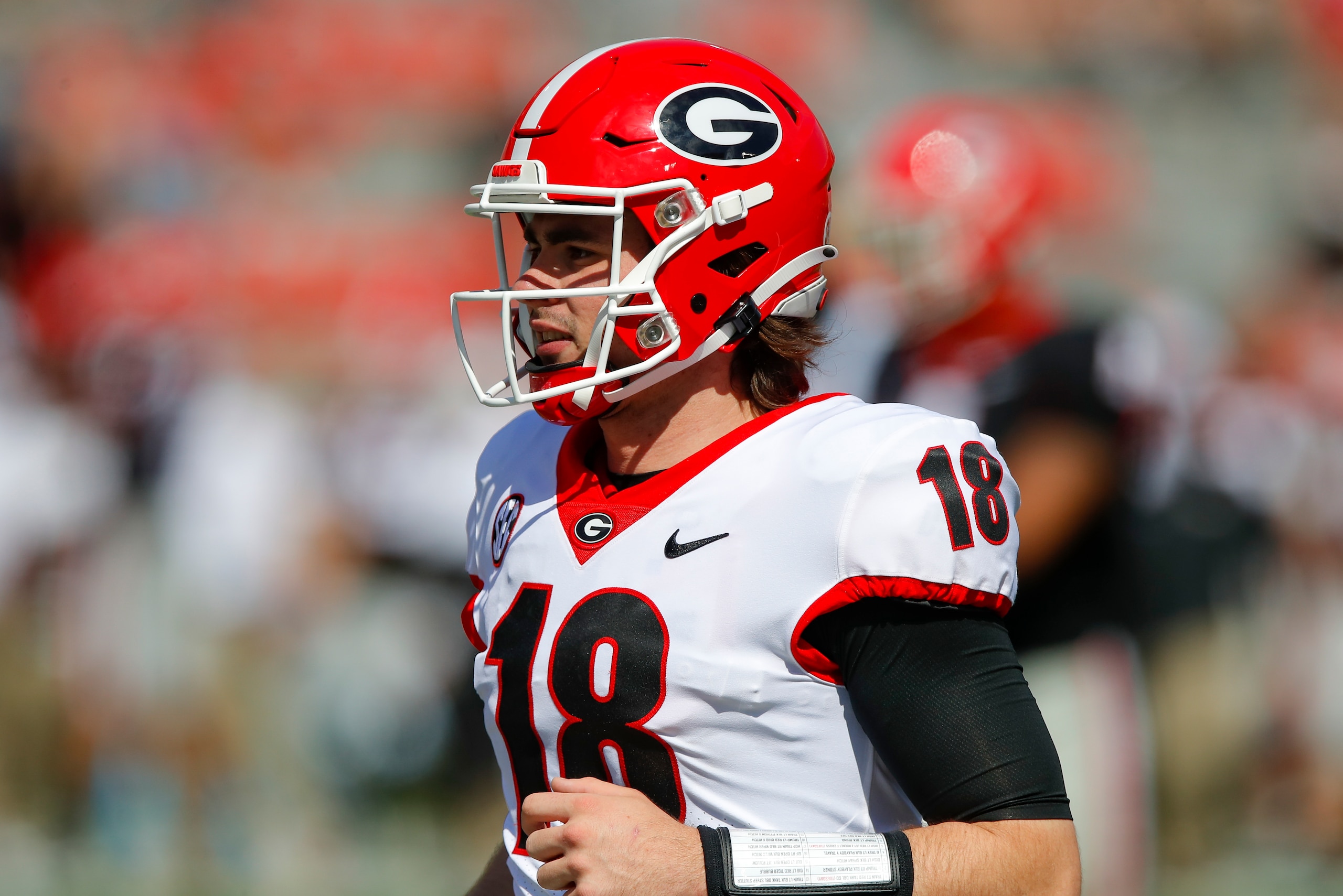 ATHENS, GA - APRIL 17: Quarterback JT Daniels #18 of the Georgia Bulldogs reacts after a touchdown during the second half of the G-Day spring game at Sanford Stadium on April 17, 2021 in Athens, Georgia. (Photo by Todd Kirkland/Getty Images)