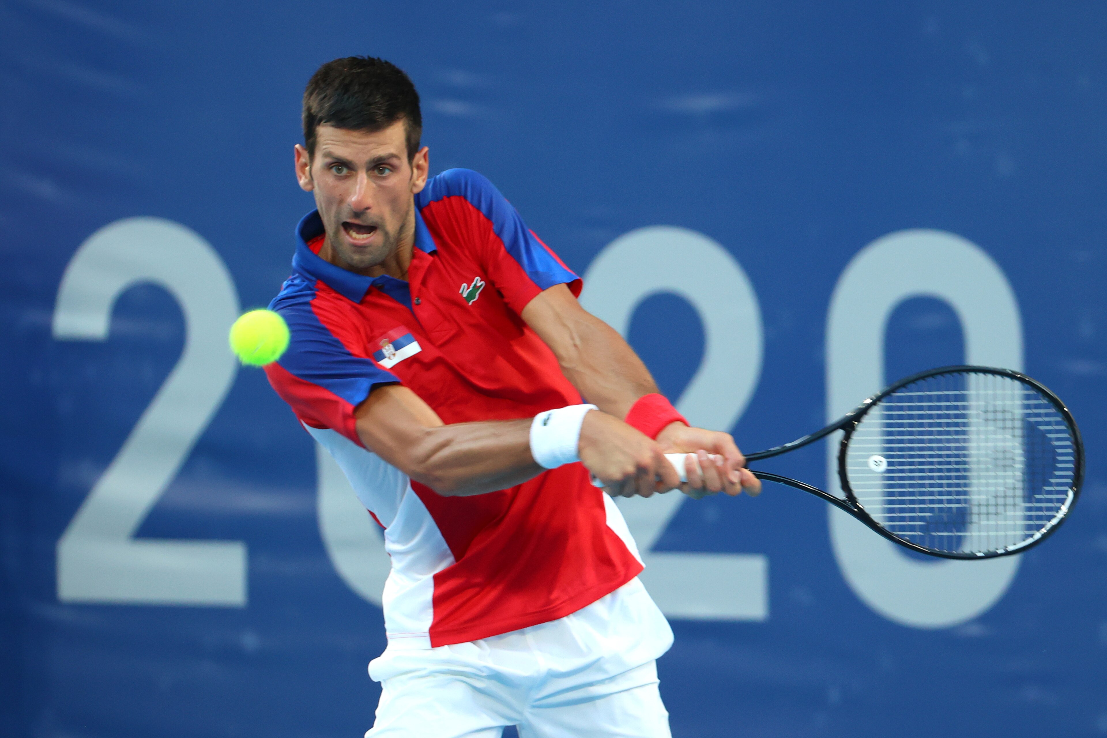 TOKYO, JAPAN - JULY 31: Novak Djokovic of Team Serbia hits a backhand against Pablo Carreno Busta of Team Spain during the Men's Singles Bronze Medal Match on day eight of the Tokyo 2020 Olympic Games at Ariake Tennis Park on July 31, 2021 in Tokyo, Japan