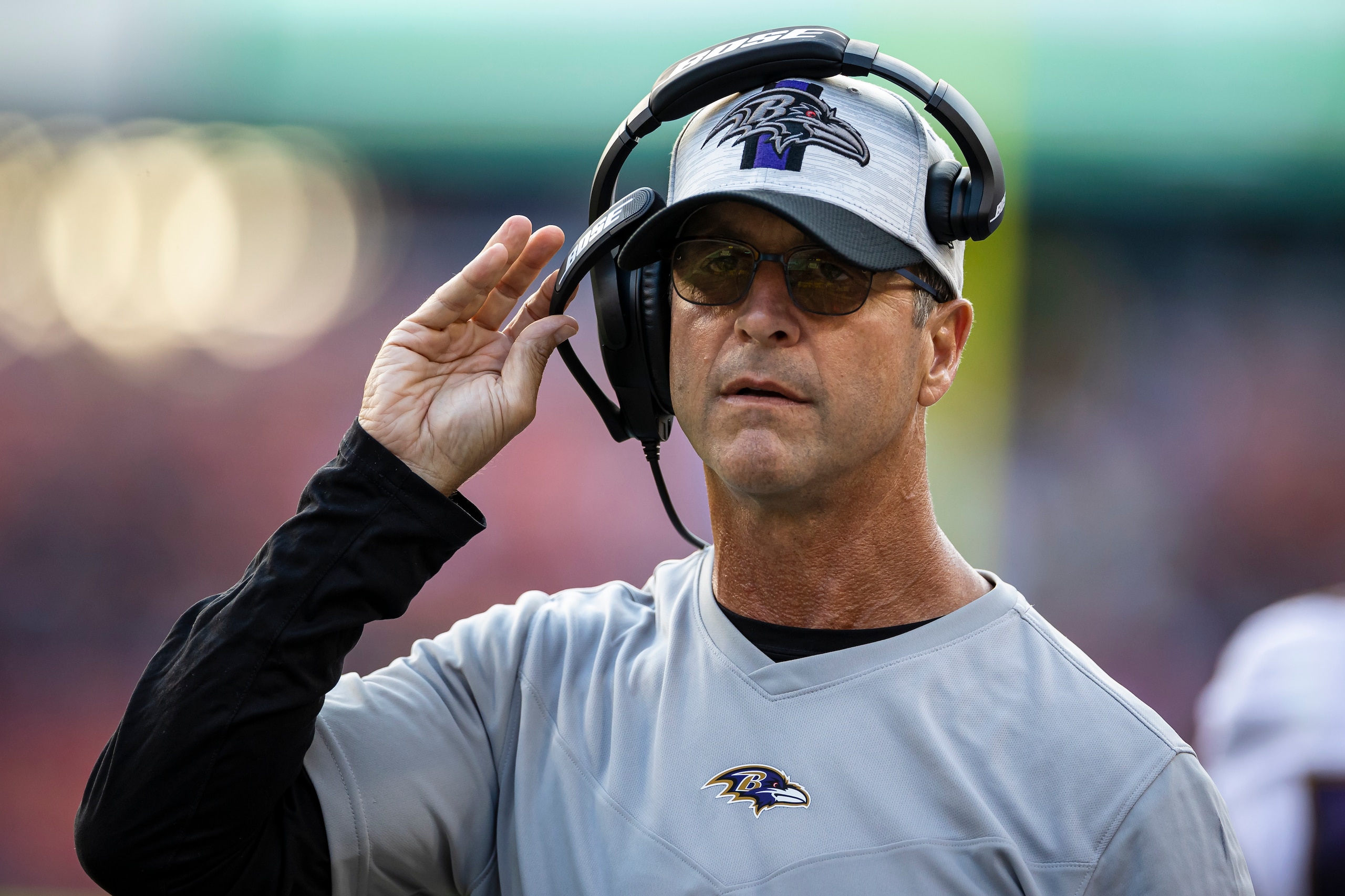 LANDOVER, MD - AUGUST 28: Head coach John Harbaugh of the Baltimore Ravens looks on during the first half of the preseason game against the Washington Football Team at FedExField on August 28, 2021 in Landover, Maryland. (Photo by Scott Taetsch/Getty Imag LANDOVER, MD - AUGUST 28: Head coach John Harbaugh of the Baltimore Ravens looks on during the first half of the preseason game against the Washington Football Team at FedExField on August 28, 2021 in Landover, Maryland. (Photo by Scott Taetsch/Getty Imag