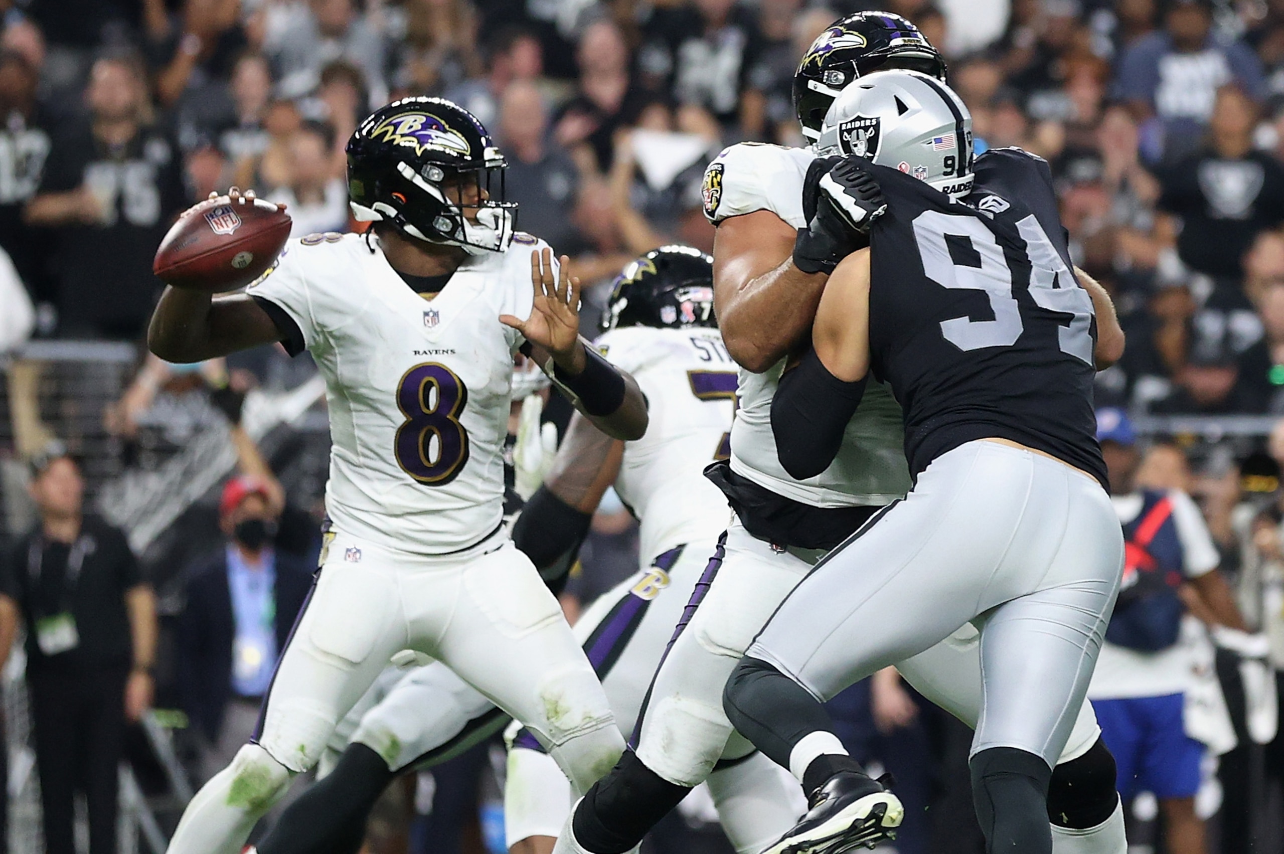 LAS VEGAS, NEVADA - SEPTEMBER 13: Quarterback Lamar Jackson #8 of the Baltimore Ravens drops back to pass during the NFL game against the Las Vegas Raiders at Allegiant Stadium on September 13, 2021 in Las Vegas, Nevada. The Raiders defeated the Ravens 33 LAS VEGAS, NEVADA - SEPTEMBER 13: Quarterback Lamar Jackson #8 of the Baltimore Ravens drops back to pass during the NFL game against the Las Vegas Raiders at Allegiant Stadium on September 13, 2021 in Las Vegas, Nevada. The Raiders defeated the Ravens 33