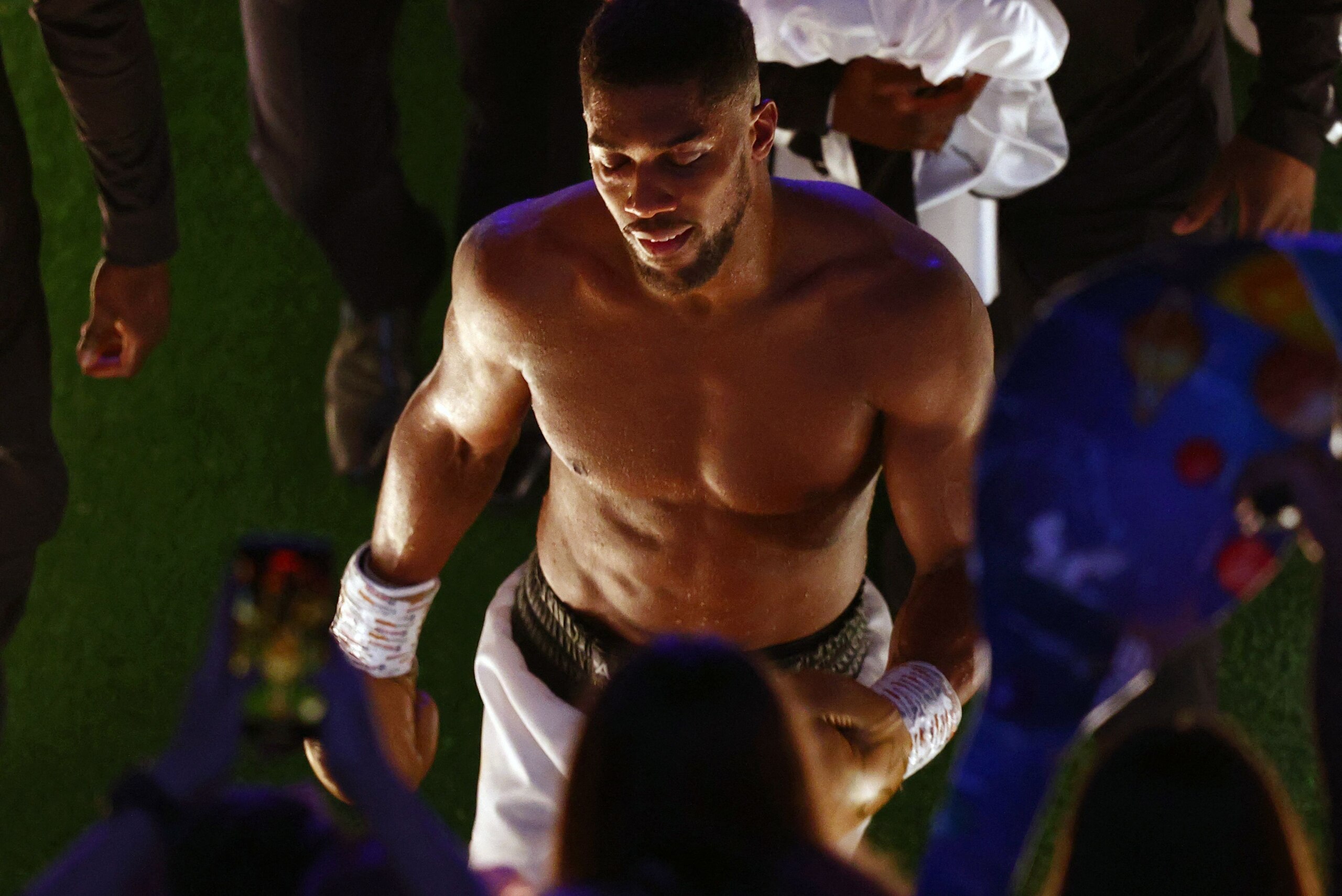 British heavyweight champion boxer Anthony Joshua leaves the arena after losing to Ukrainian boxer Oleksandr Usyk during their heavyweight boxing match at Tottenham Hotspur Stadium in north London on September 25, 2021. - Usyk defeated Joshua on points. (