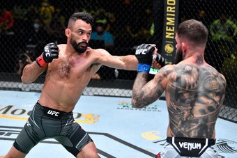 LAS VEGAS, NEVADA - MAY 22: In this handout image provided by UFC, (L-R) Rob Font punches Cody Garbrandt in their bantamweight bout during the UFC Fight Night event at UFC APEX on May 22, 2021 in Las Vegas, Nevada. (Photo by Chris Unger/Zuffa LLC via Gett