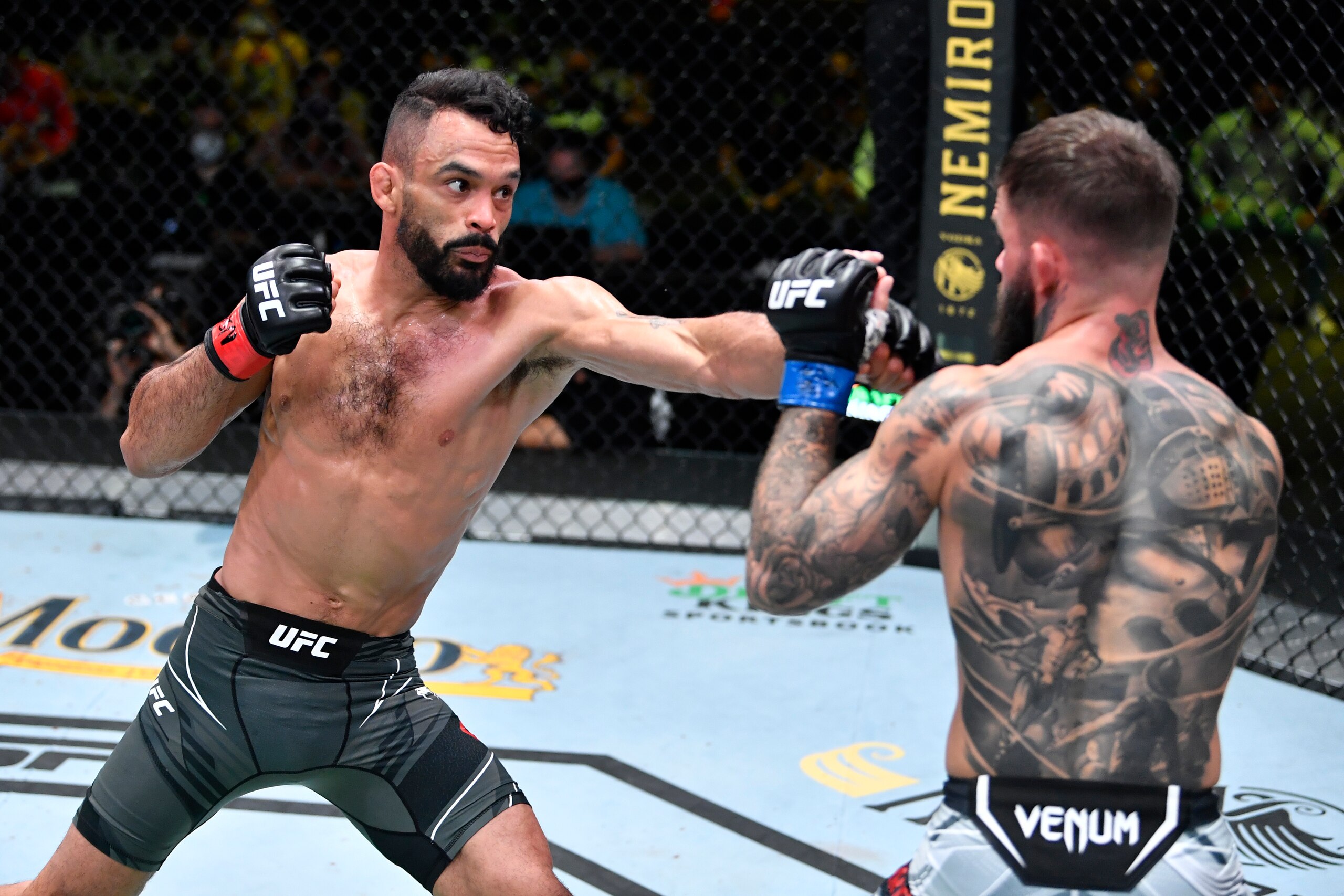 LAS VEGAS, NEVADA - MAY 22: In this handout image provided by UFC, (L-R) Rob Font punches Cody Garbrandt in their bantamweight bout during the UFC Fight Night event at UFC APEX on May 22, 2021 in Las Vegas, Nevada. (Photo by Chris Unger/Zuffa LLC via Gett