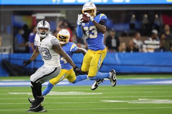 INGLEWOOD, CALIFORNIA - OCTOBER 04: Free safety Derwin James #33 of the Los Angeles Chargers intercepts a pass intended for tight end Darren Waller #83 of the Las Vegas Raiders during the fourth quarter at SoFi Stadium on October 4, 2021 in Inglewood, Cal