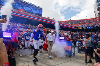 GAINESVILLE, FL - OCTOBER 09: Florida Gators wide receiver Jacob Copeland (1) runs out alongside Florida Gators head coach Dan Mullen during the game between the Vanderbilt Commodores and the Florida Gators on October 9, 2021 at Ben Hill Griffin Stadium i