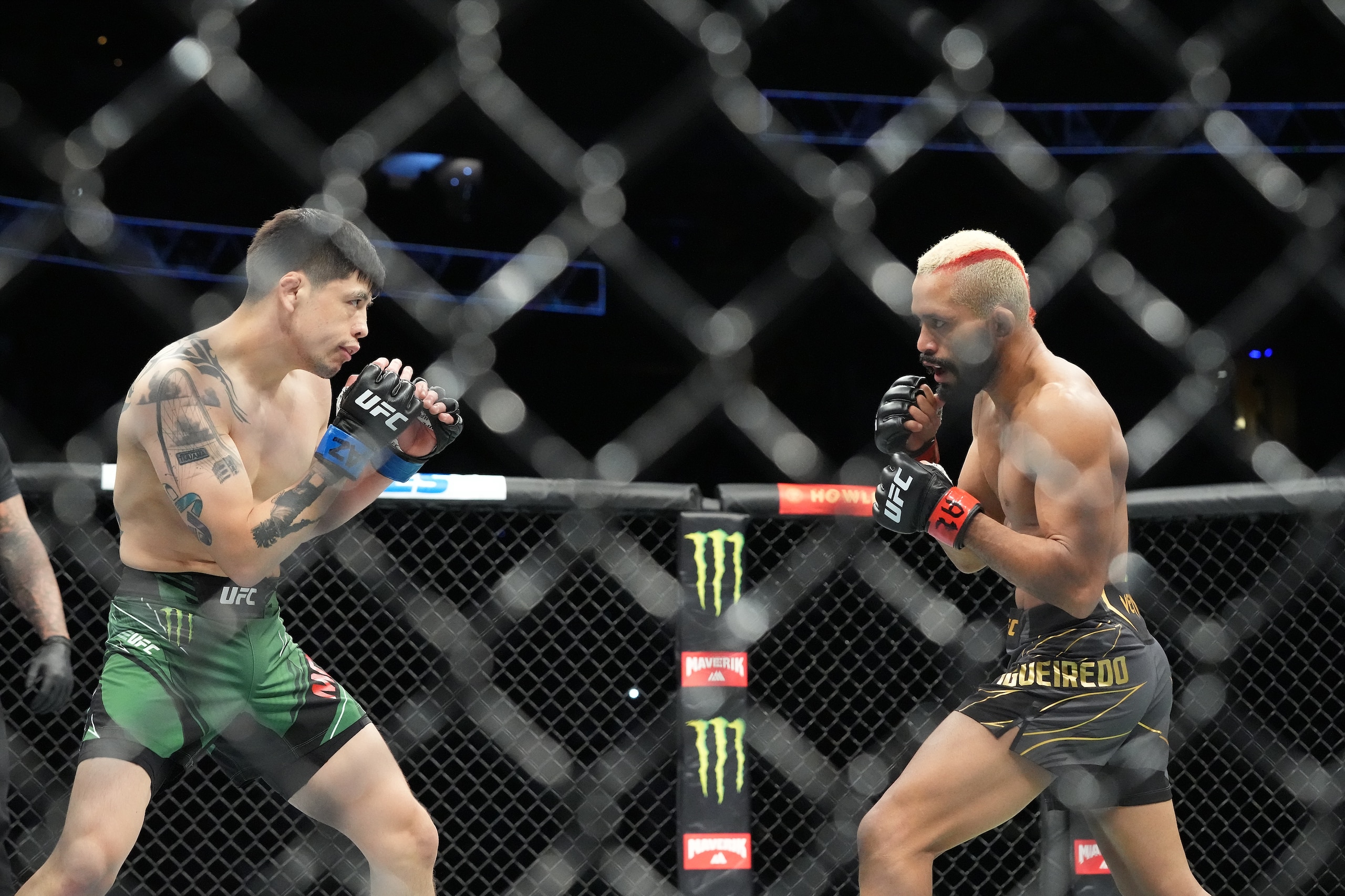 GLENDALE, AZ - JUNE 12: Deiveson Figueiredo (red gloves) and Brandon Moreno (blue gloves) during UFC 263 on June 12, 2021, at Gila River Arena in Glendale, AZ. (Photo by Louis Grasse/PxImages/Icon Sportswire via Getty Images)