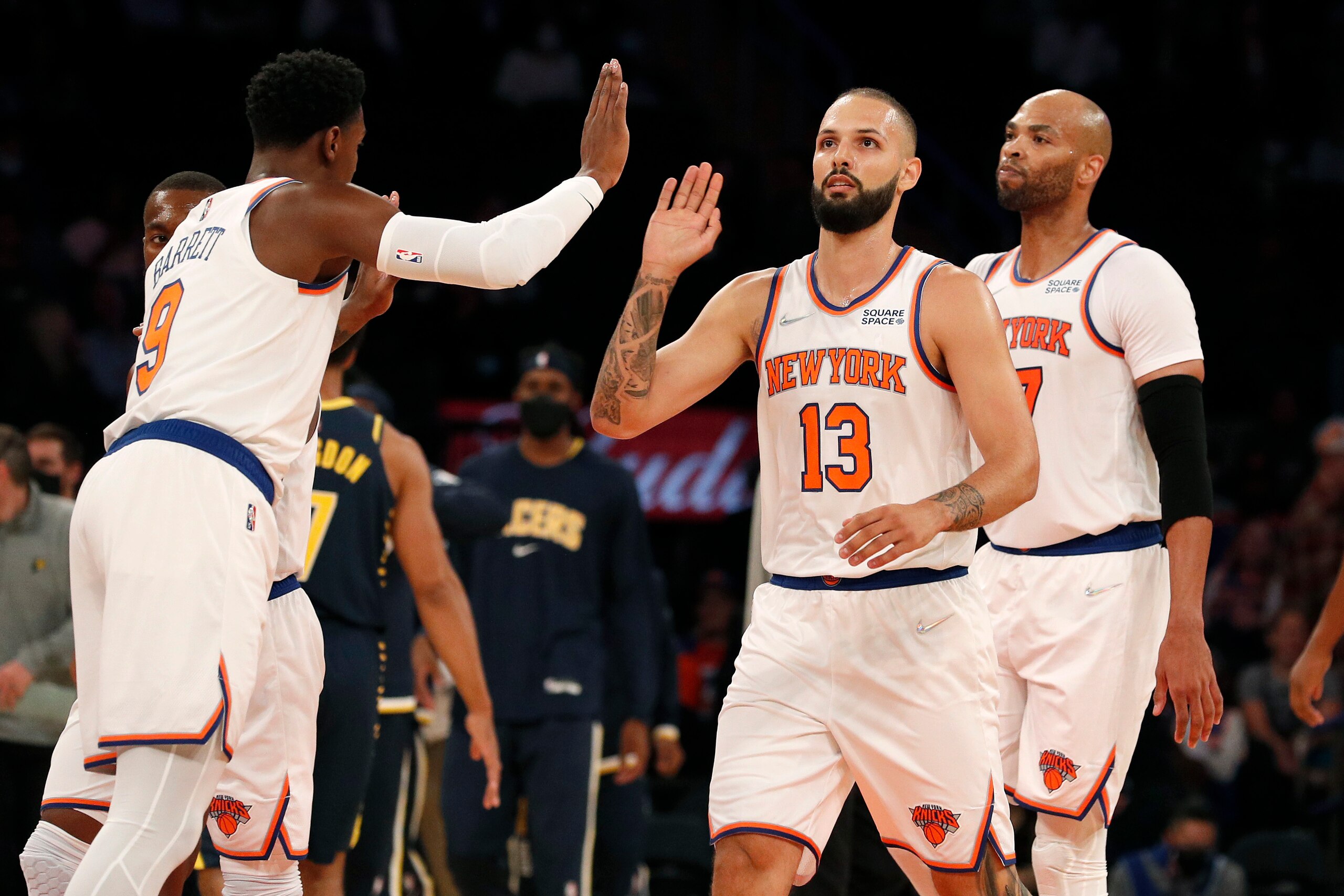 NEW YORK, NEW YORK - OCTOBER 05:  (NEW YORK DAILIES OUT)  Evan Fournier #13 and RJ Barrett #9 of the New York Knicks in action against the Indiana Pacers at Madison Square Garden on October 05, 2021 in New York City. The Knicks defeated the pacers 125-104