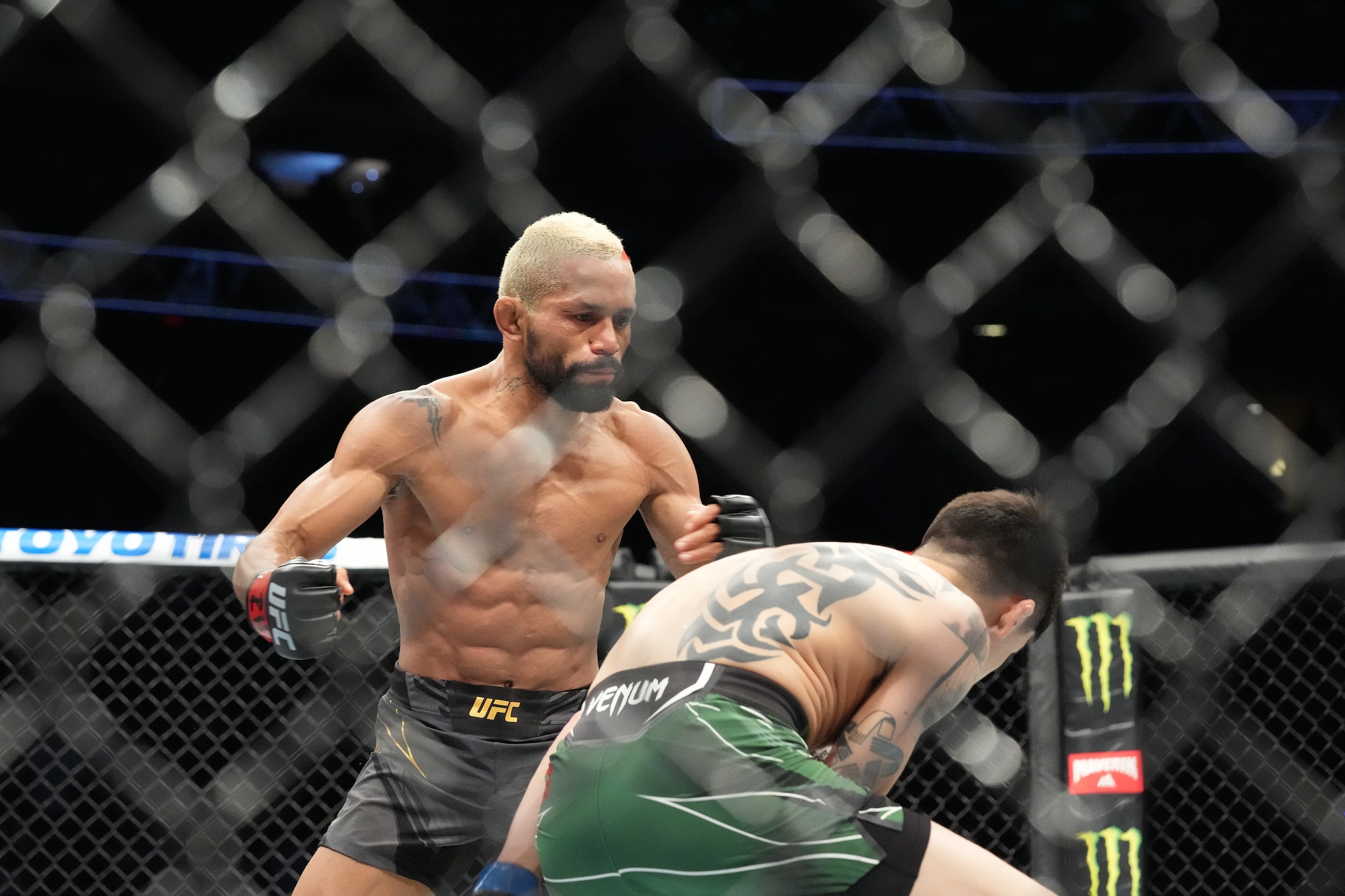 GLENDALE, AZ - JUNE 12: Deiveson Figueiredo (red gloves) and Brandon Moreno (blue gloves) during UFC 263 on June 12, 2021, at Gila River Arena in Glendale, AZ. (Photo by Louis Grasse/PxImages/Icon Sportswire via Getty Images)