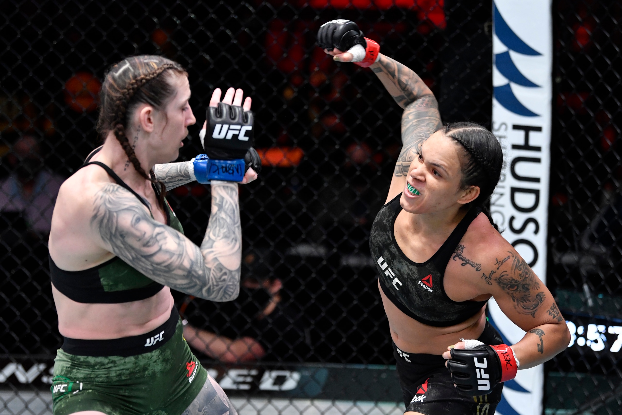 LAS VEGAS, NEVADA - MARCH 06: (R-L) Amanda Nunes of Brazil punches Megan Anderson of Australia in their UFC featherweight championship fight during the UFC 259 event at UFC APEX on March 06, 2021 in Las Vegas, Nevada. (Photo by Jeff Bottari/Zuffa LLC)