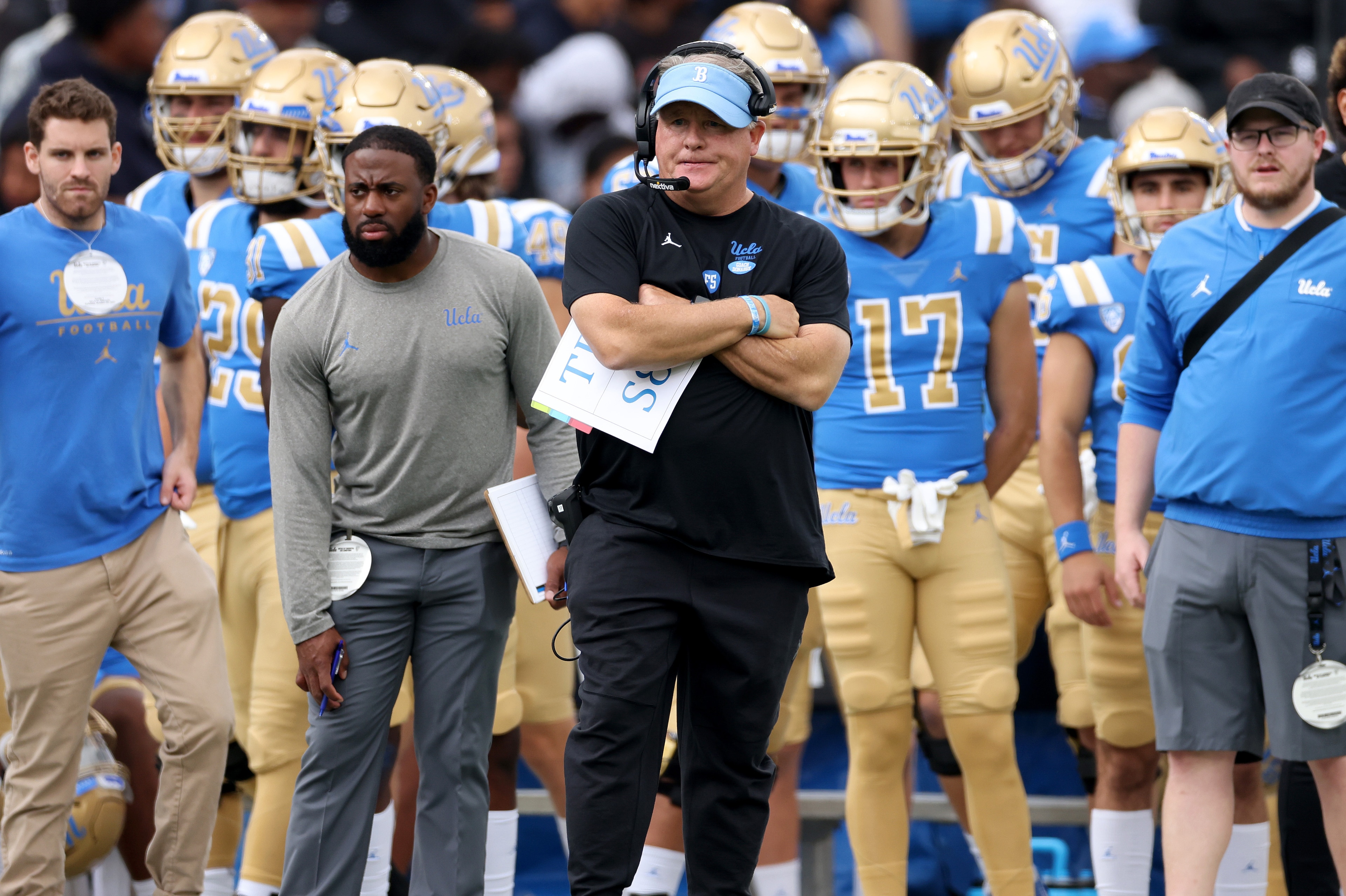 PASADENA, CALIFORNIA - OCTOBER 23: Head coach Chip Kelly of the UCLA Bruins reacts after an Oregon Ducks touchdown to tie the game 14-14 during the first half at Rose Bowl on October 23, 2021 in Pasadena, California. (Photo by Harry How/Getty Images)