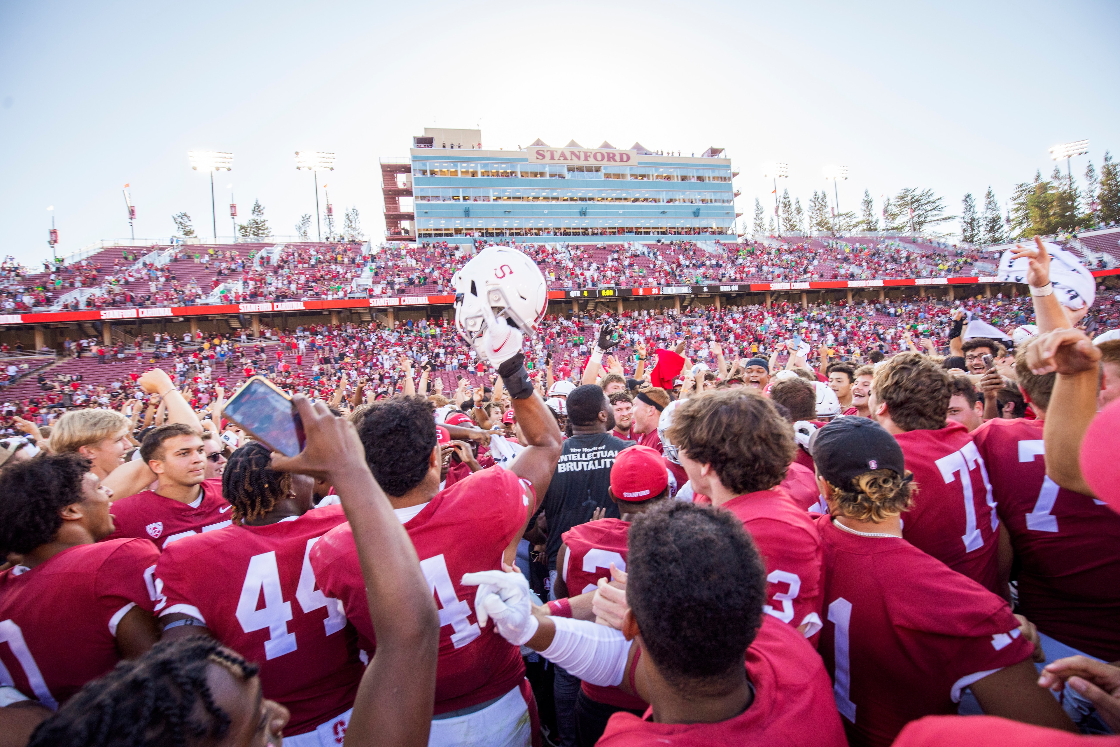 PALO ALTO, CA - OCTOBER 2:  Stanford Cardinal football players and fans celebrate on the field after the Stanford's 31-24 overtime victory over the Oregon Ducks in a Pac-12 college football game on October 2, 2021 at Stanford Stadium in Palo Alto, Califor