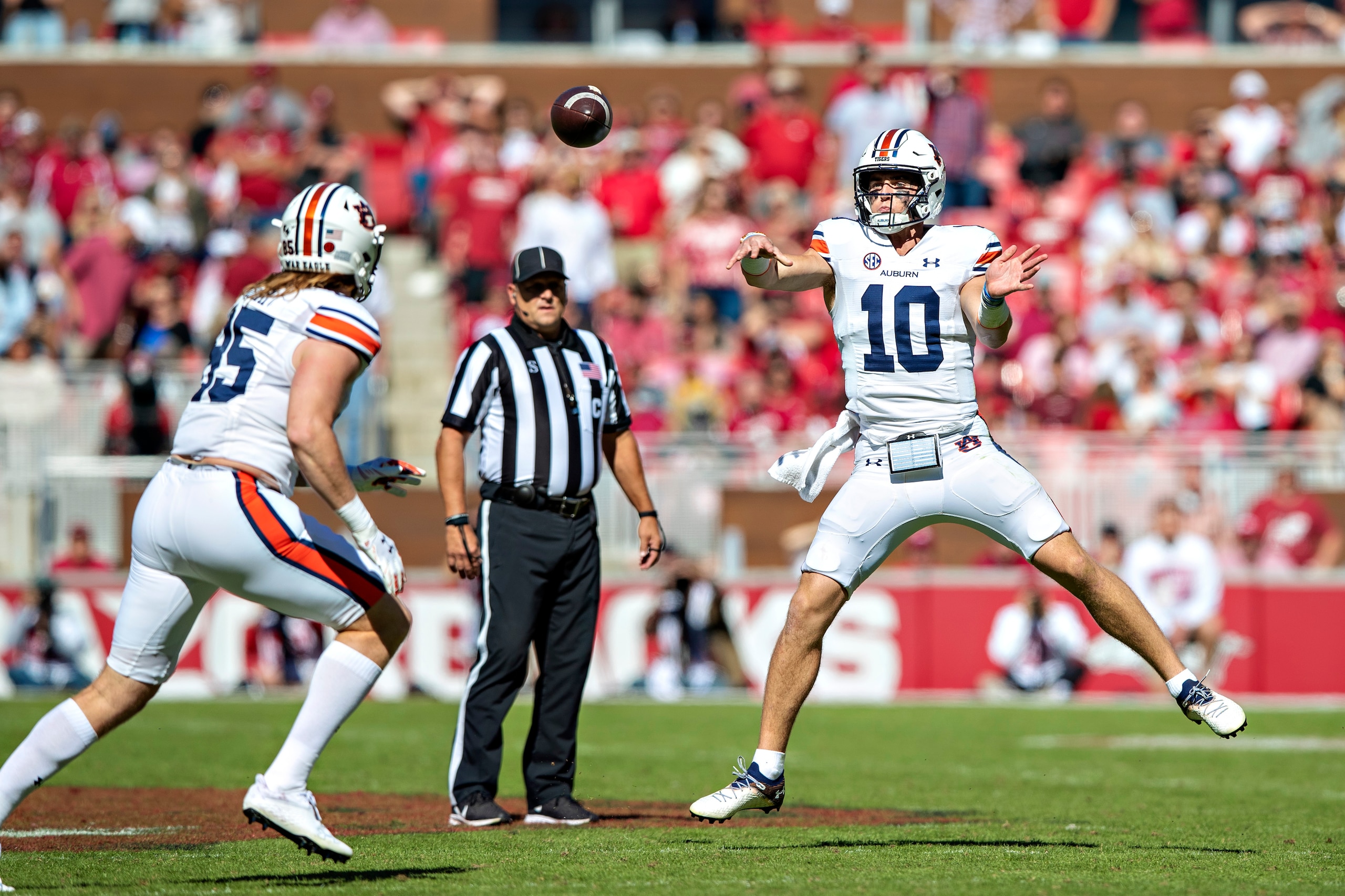 FAYETTEVILLE, ARKANSAS - OCTOBER 16: Bo Nix #10 throws a pass to Tyler Fromm #85 of the Auburn Tigers in the second half during a game against the Arkansas Razorbacks at Donald W. Reynolds Razorback Stadium on October 16, 2021 in Fayetteville, Arkansas. T