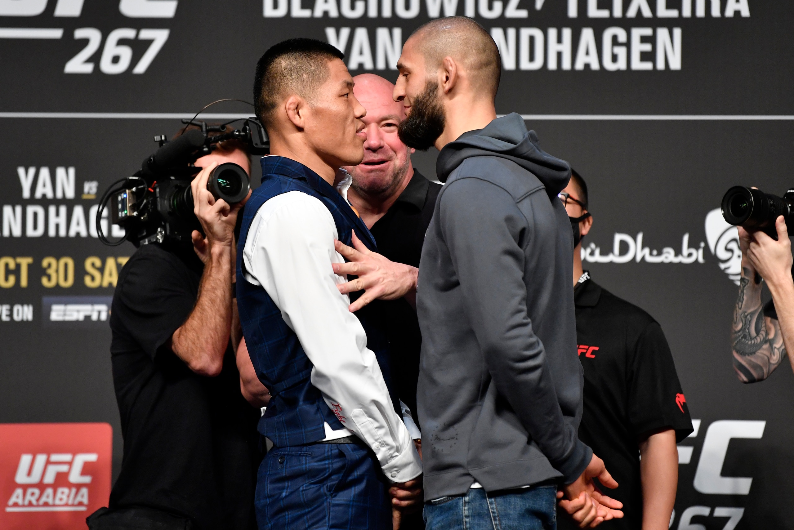 ABU DHABI, UNITED ARAB EMIRATES - OCTOBER 28: (L-R) Opponents Li Jingliang of China and Khamzat Chimaev of Chechnya face off during the UFC 267 press conference at Etihad Arena on October 28, 2021 in Abu Dhabi, United Arab Emirates. (Photo by Chris Unger/