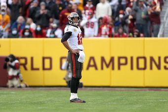 LANDOVER, MARYLAND - NOVEMBER 14: Quarterback Tom Brady #12 of the Tampa Bay Buccaneers looks on after failing to convert on third down in the first half against the Washington Football Team at FedExField on November 14, 2021 in Landover, Maryland. (Photo