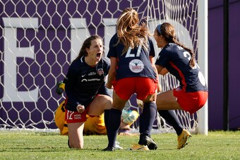 LOUISVILLE, KENTUCKY - NOVEMBER 20: Andi Sullivan #12 of Washington Spirit celebrates with teammates Tara McKeown #27 and Ashley Hatch #33 after scoring during the second half against Chicago Red Stars during the NWSL Championship held at Lynn Family Stad