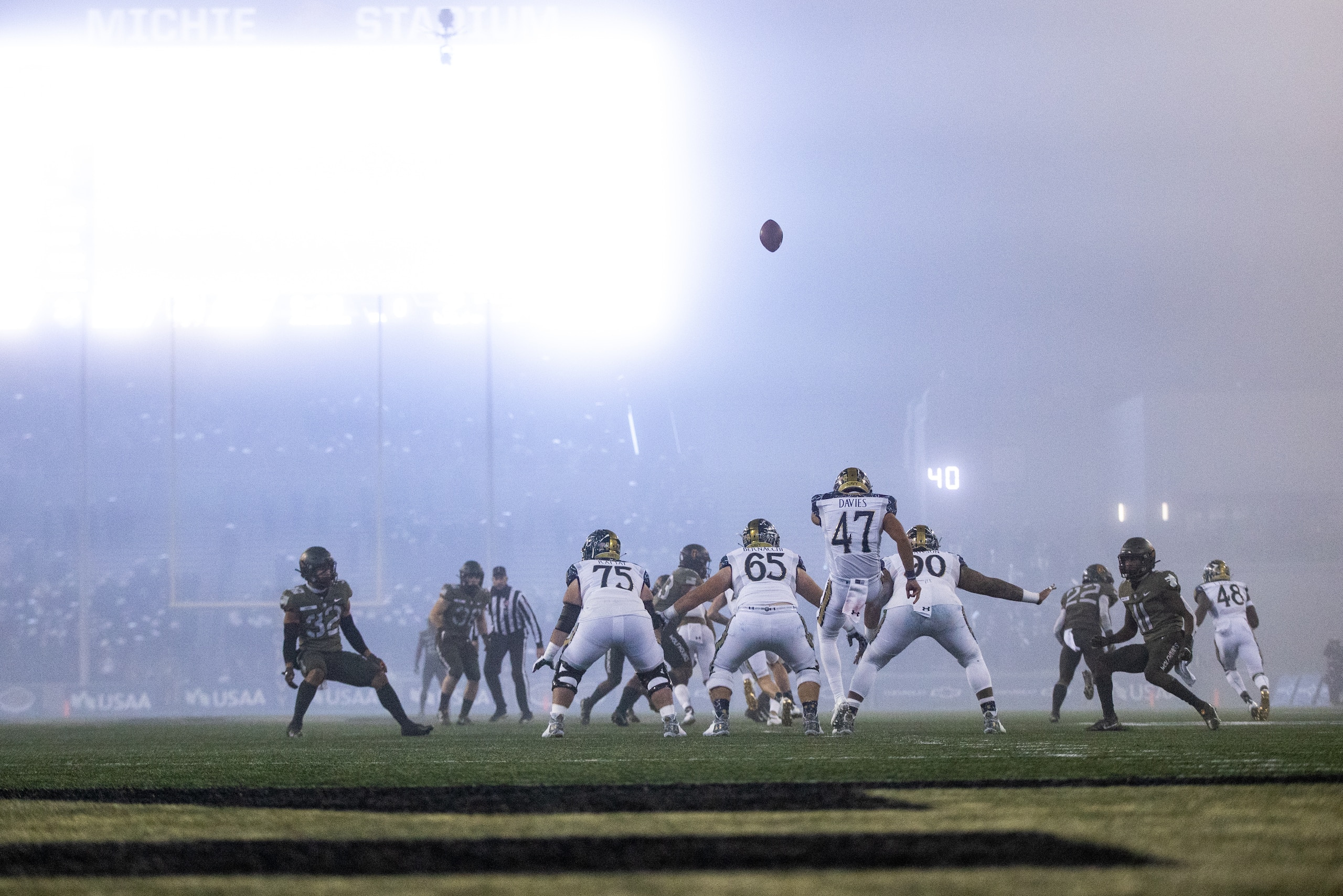WEST POINT, NY - DECEMBER 12: Daniel Davies #47 of the Navy Midshipmen punts the ball during the fourth quarter of a game against the Army Black Knights at Michie Stadium on December 12, 2020 in West Point, New York. (Photo by Dustin Satloff/Getty Images)