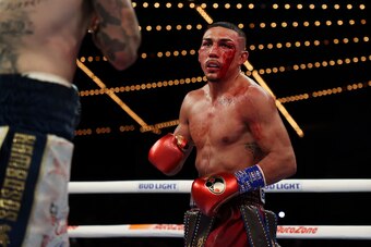 NEW YORK, NEW YORK - NOVEMBER 27:  Teofimo Lopez bleeds from a cut over his eye against George Kambosos during their championship bout for Lopez’s Undisputed Lightweight title at The Hulu Theater at Madison Square Garden on November 27, 2021 in New York, 