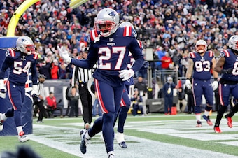 FOXBOROUGH, MA - NOVEMBER 28: New England Patriots defensive back J.C. Jackson (27) celebrates his pick in the end zone during a game between the New England Patriots and the Tennessee Titans on November 28, 2021, at Gillette Stadium in Foxborough, Massac