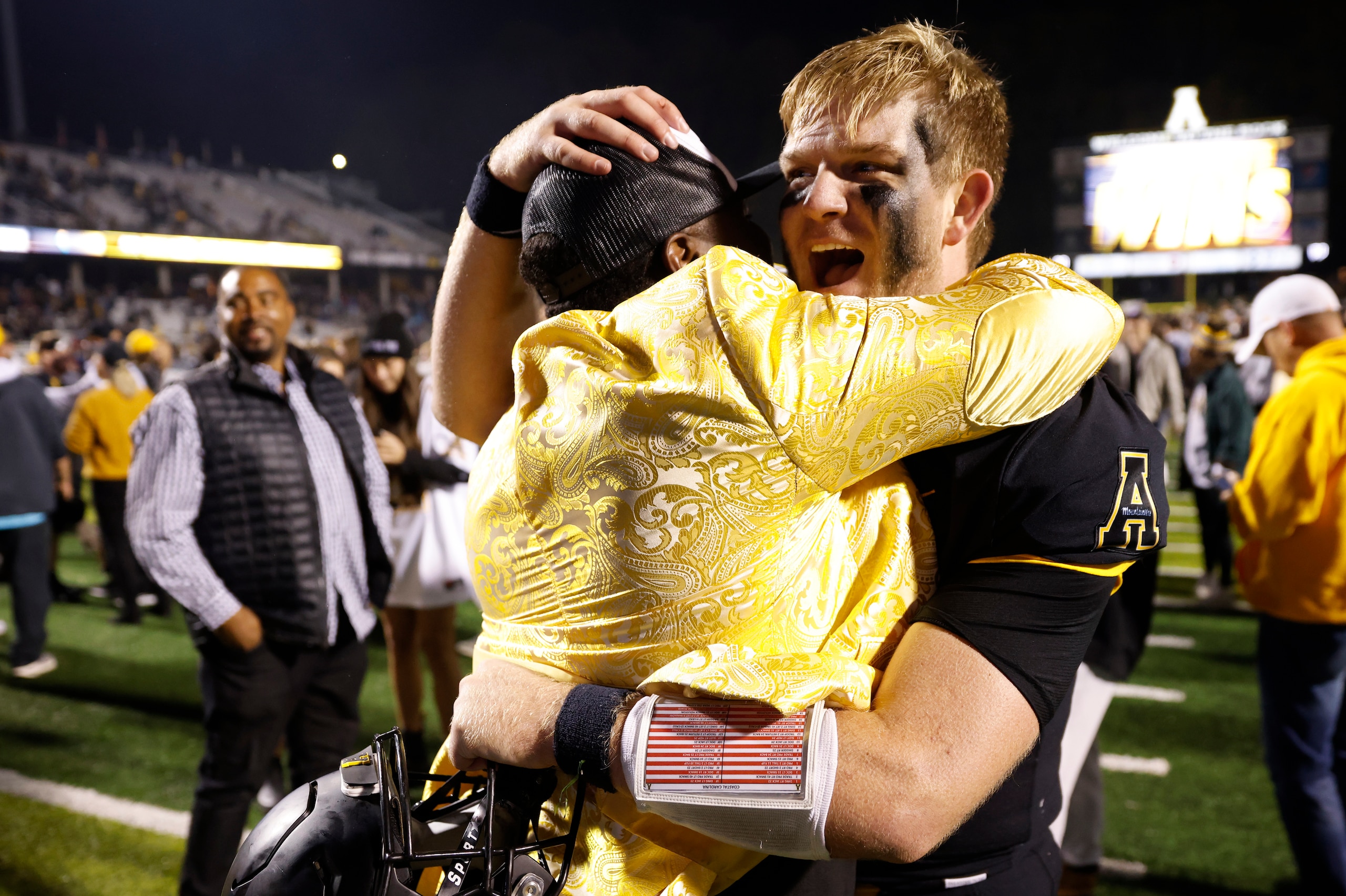 BOONE, NC - OCTOBER 20: Appalachian State Mountaineers quarterback Chase Brice (7) celebrates with fans following a college football game against the Coastal Carolina Chanticleers on Oct. 20, 2021 at Kidd Brewer Stadium in Boone, North Carolina. (Photo by