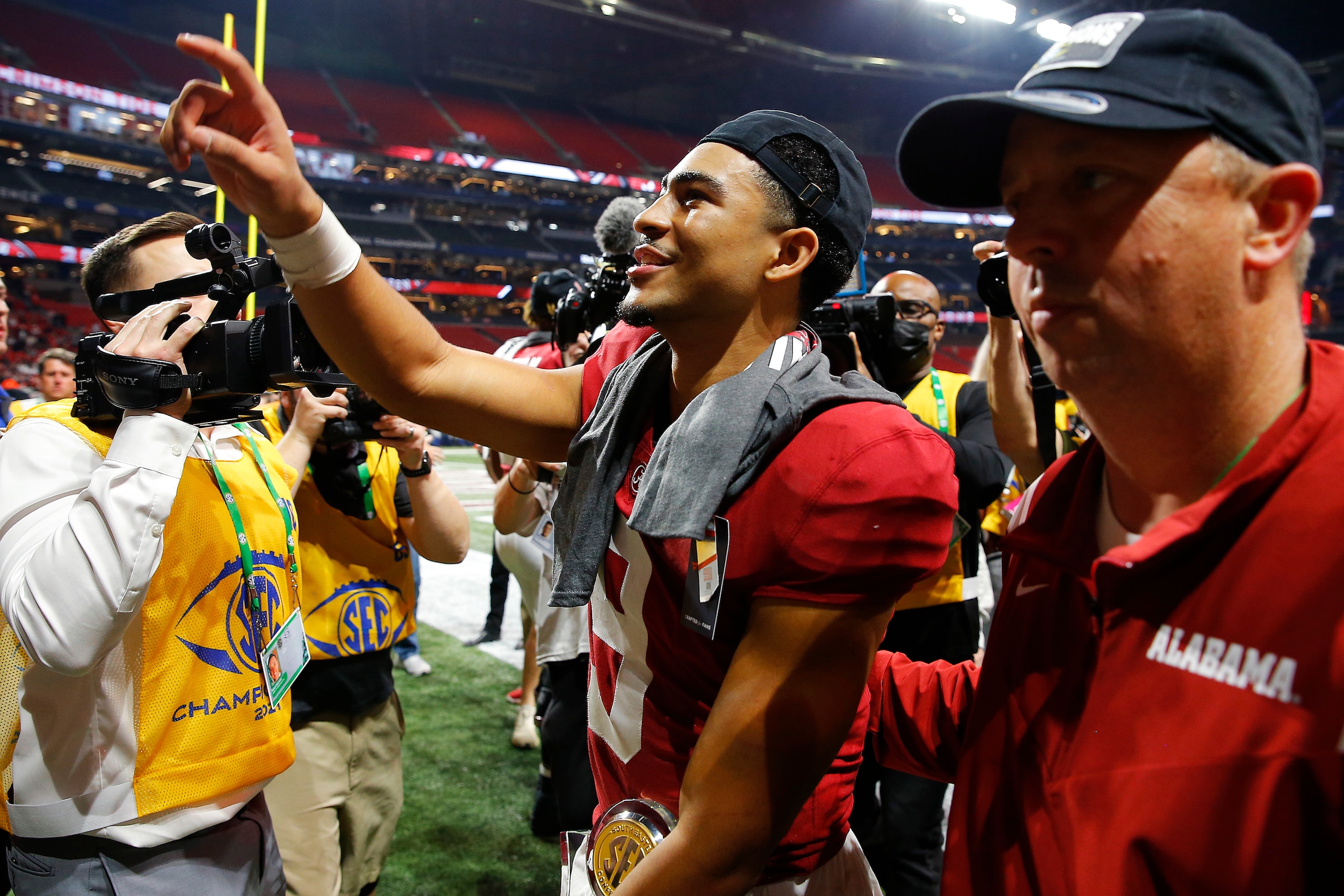 ATLANTA, GEORGIA - DECEMBER 04: Bryce Young #9 of the Alabama Crimson Tide leaves the field after beating the Georgia Bulldogs in the SEC Championship game against the at Mercedes-Benz Stadium on December 04, 2021 in Atlanta, Georgia. (Photo by Todd Kirkl