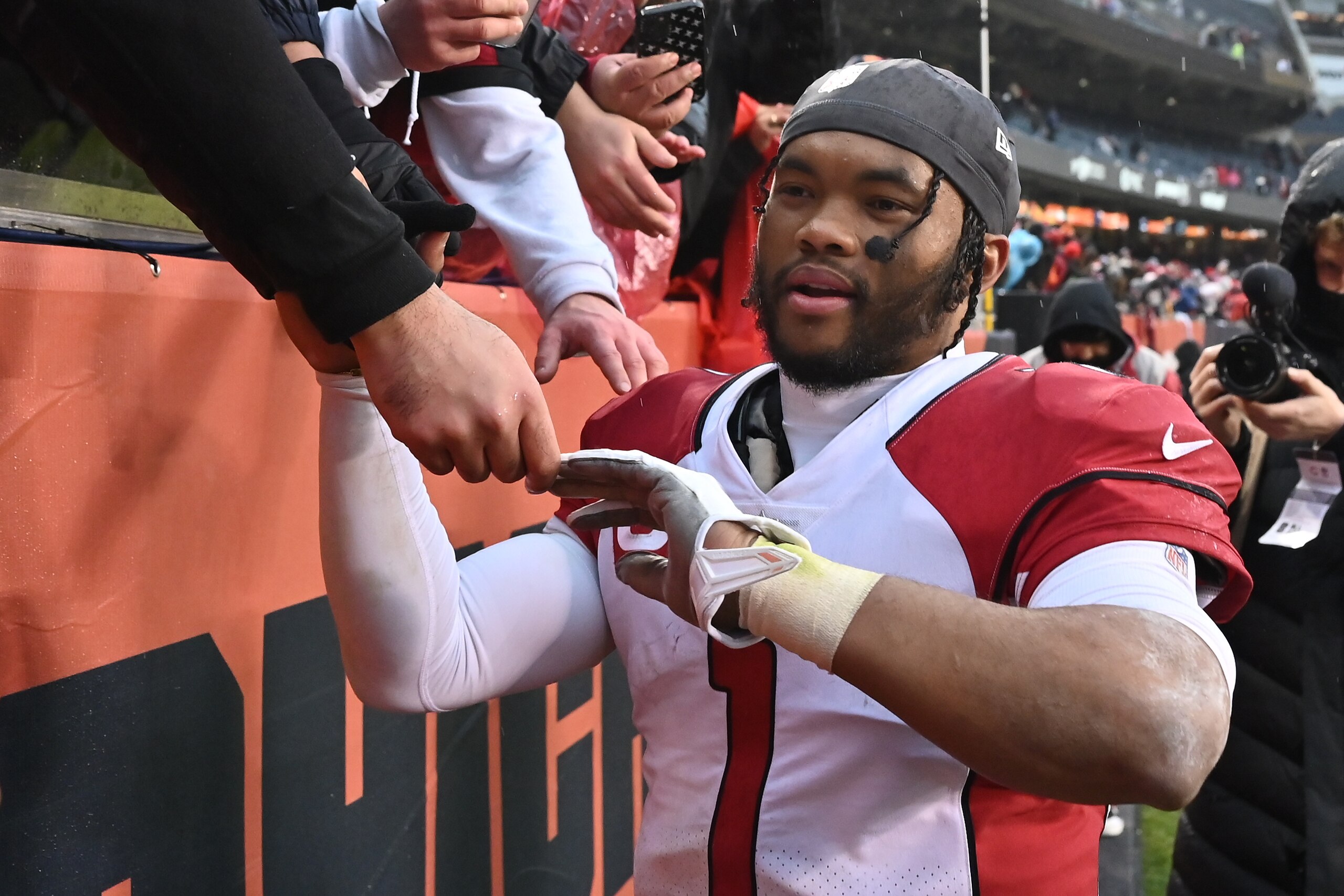 CHICAGO, ILLINOIS - DECEMBER 05:  Quarterback Kyler Murray #1 of the Arizona Cardinals celebrates with fans after Arizona defeated the Chicago Bears 33-22 at Soldier Field on December 05, 2021 in Chicago, Illinois.  (Photo by Jamie Sabau/Getty Images)
