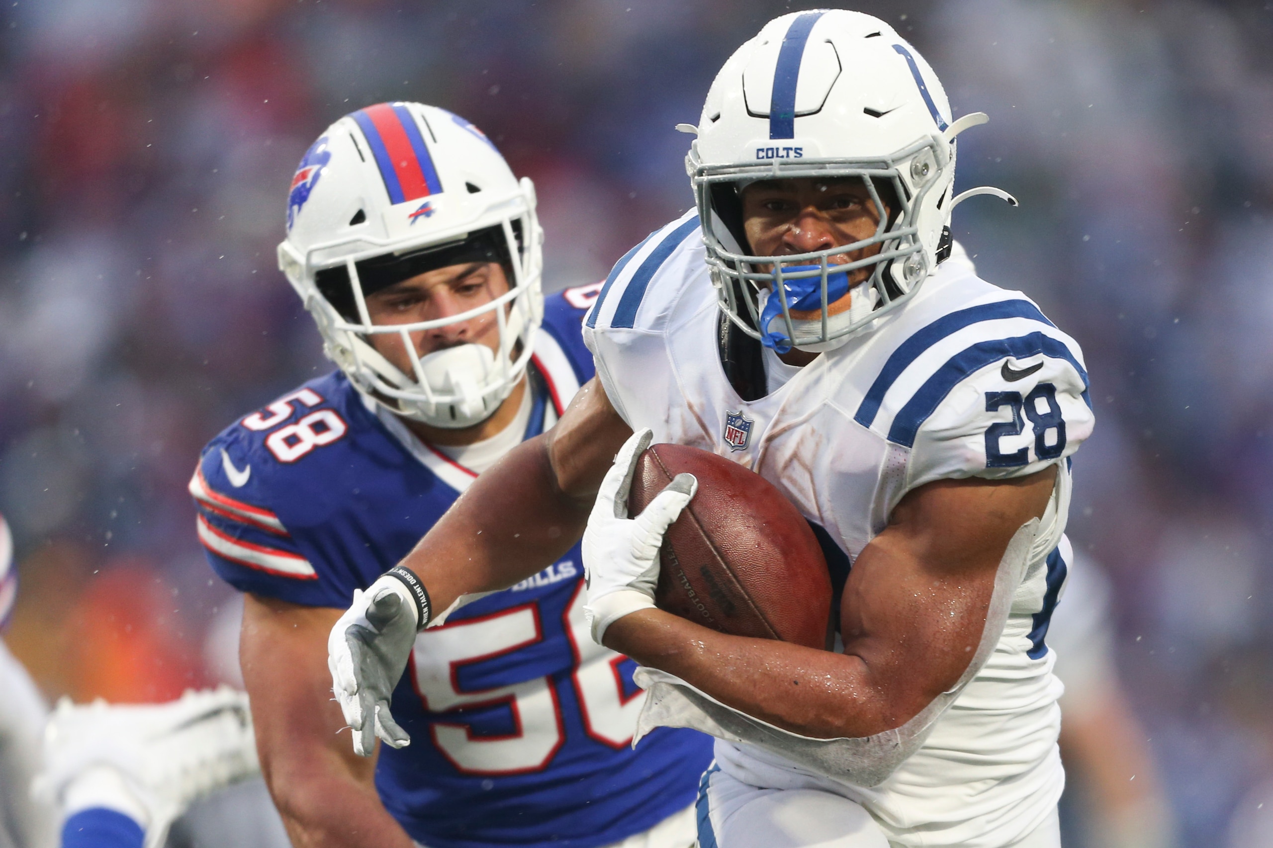 ORCHARD PARK, NEW YORK - NOVEMBER 21: Jonathan Taylor #28 of the Indianapolis Colts rushes during the second half against the Buffalo Bills at Highmark Stadium on November 21, 2021 in Orchard Park, New York. (Photo by Joshua Bessex/Getty Images)