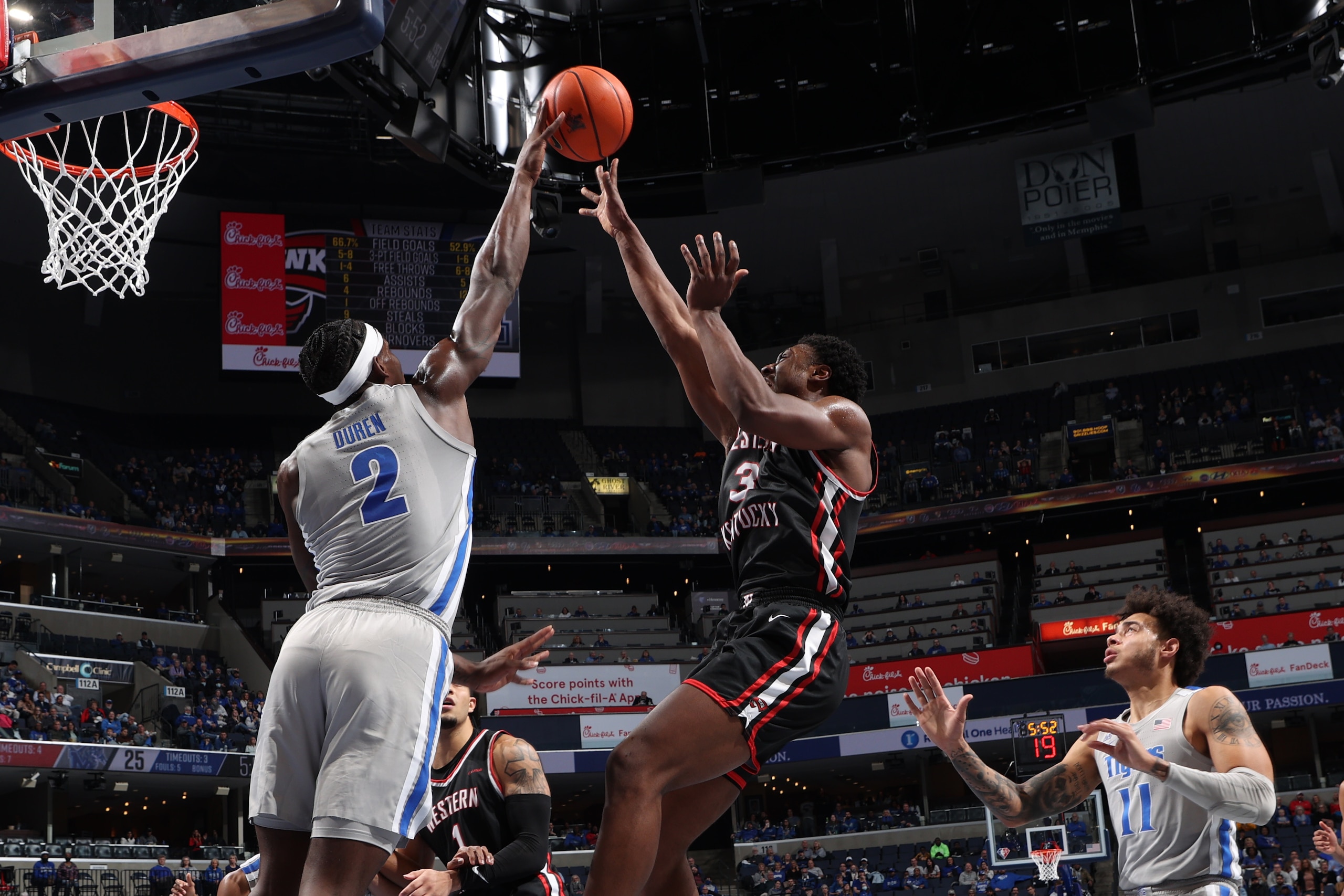 MEMPHIS, TN - NOVEMBER 19: Jalen Duren #2 of the Memphis Tigers blocks a shot attempt by Jairus Hamilton #3 of the Western Kentucky Hilltoppers during a game on November 19, 2021 at FedExForum in Memphis, Tennessee. Memphis defeated Western Kentucky 74-62