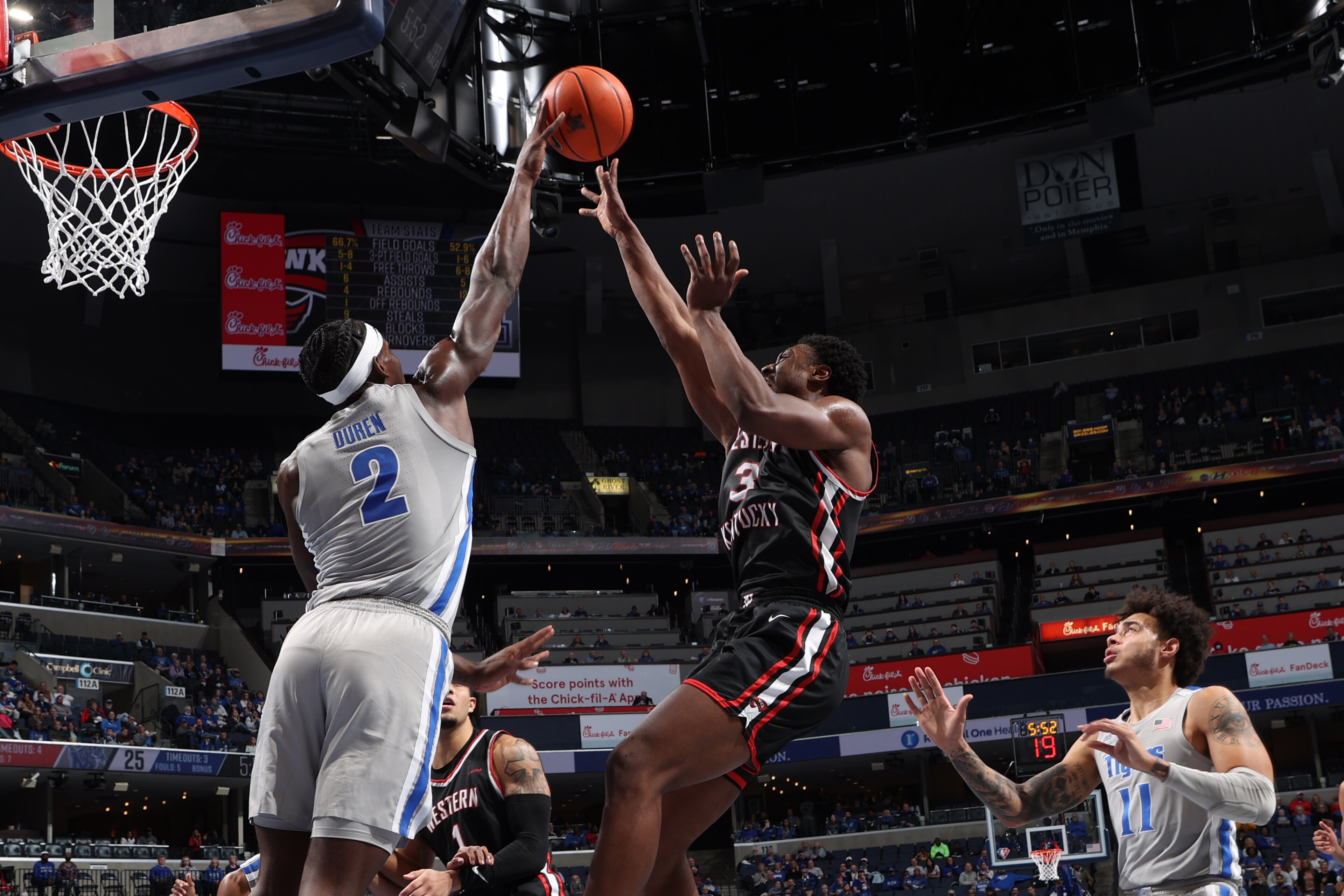 MEMPHIS, TN - NOVEMBER 19: Jalen Duren #2 of the Memphis Tigers blocks a shot attempt by Jairus Hamilton #3 of the Western Kentucky Hilltoppers during a game on November 19, 2021 at FedExForum in Memphis, Tennessee. Memphis defeated Western Kentucky 74-62