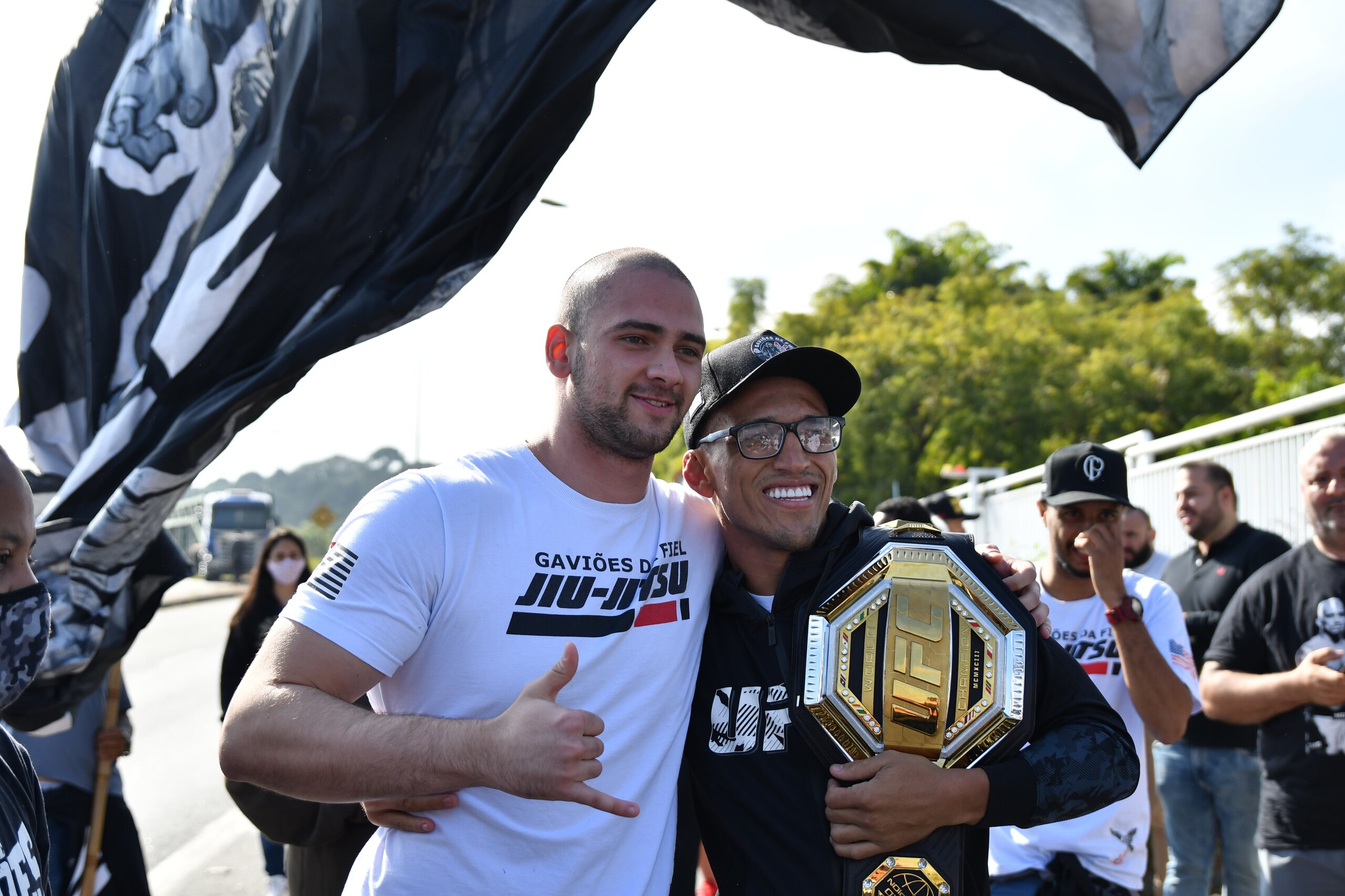 SAO PAULO, BRAZIL - MAY 17: Fans cheer as the MMA fighter Charles Oliveira arrives at Sao Paulos International Airport on May 17, 2021 in Guarulhos, Sao Paulo, Brazil. The Brazilian is the new UFC Lightweight Champion after beating Michael Chandler in the