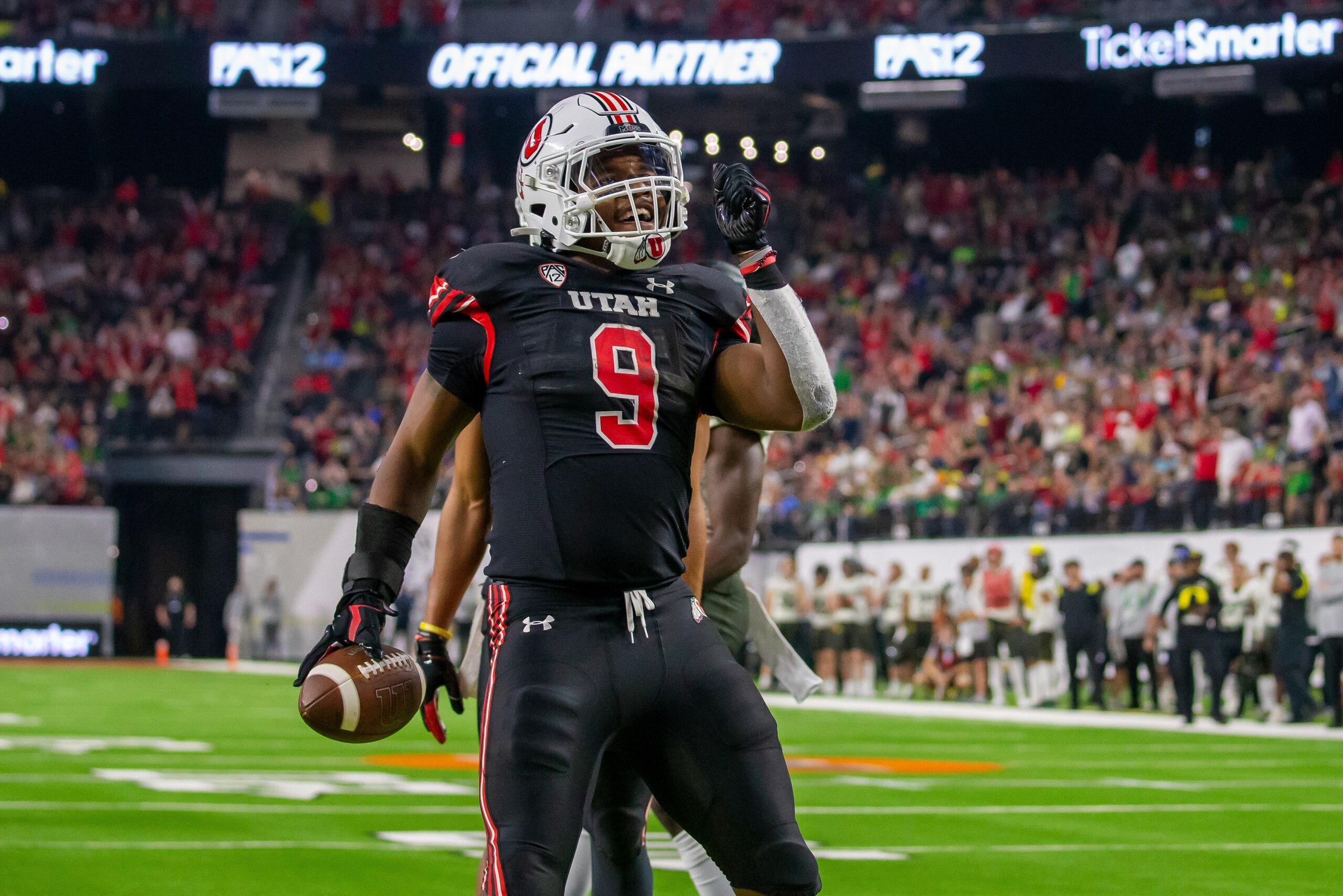 PARADISE, NV - DECEMBER 03: Running back Tavion Thomas #9 of the Utah Utes scores a touchdown during the second half of the Pac-12 Championship Game featuring the University Oregon Ducks and the University of Utah Utes on December 3, 2021 at Allegiant Sta
