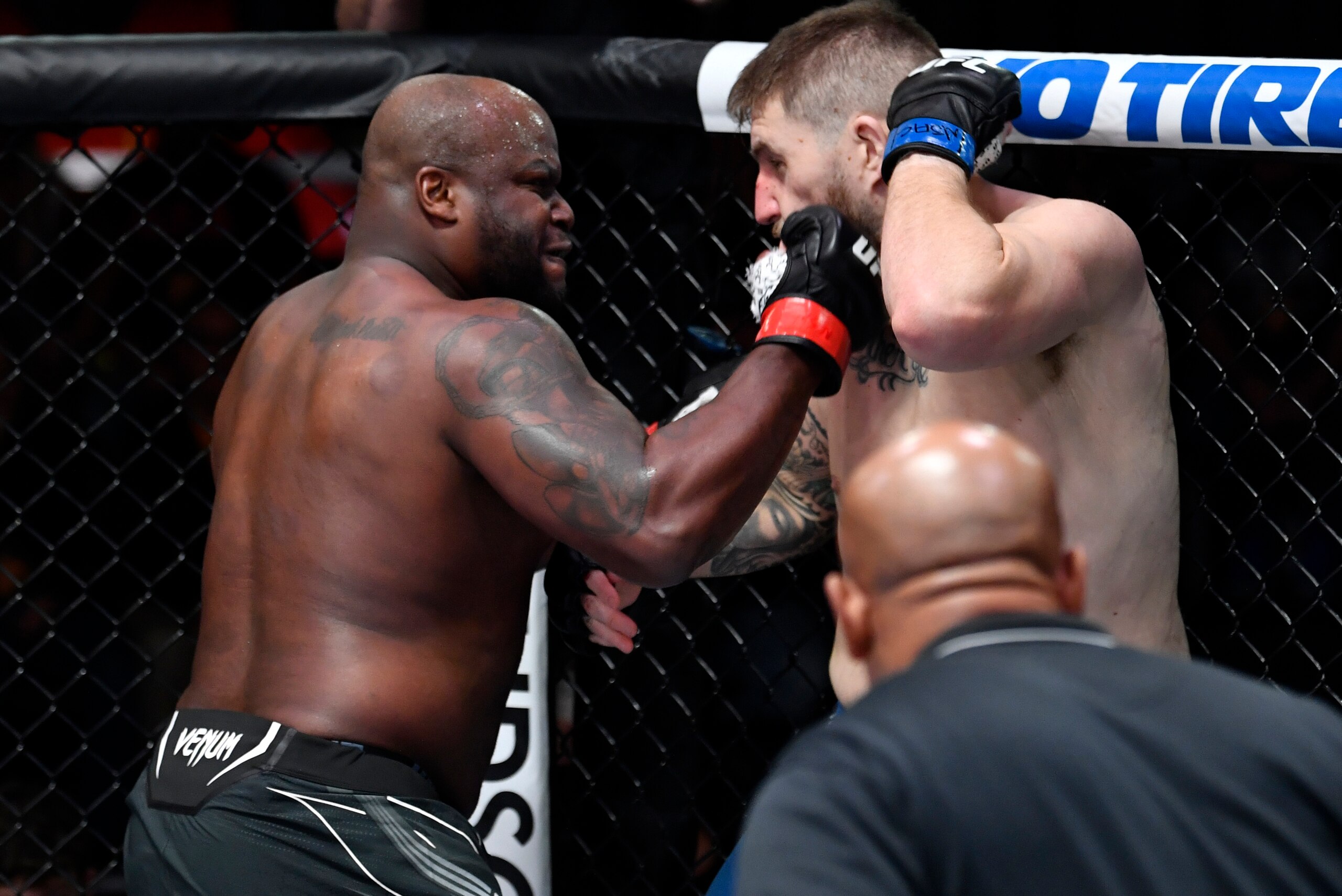LAS VEGAS, NEVADA - DECEMBER 18: (L-R) Derrick Lewis punches Chris Daukaus in their heavyweight fight during the UFC Fight Night event at UFC APEX on December 18, 2021 in Las Vegas, Nevada. (Photo by Jeff Bottari/Zuffa LLC)