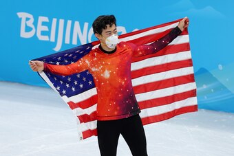 BEIJING, CHINA - FEBRUARY 10: Gold medalist Nathan Chen of Team United States celebrates during the Men Single Skating flower ceremony on day six of the Beijing 2022 Winter Olympic Games at Capital Indoor Stadium on February 10, 2022 in Beijing, China. (P BEIJING, CHINA - FEBRUARY 10: Gold medalist Nathan Chen of Team United States celebrates during the Men Single Skating flower ceremony on day six of the Beijing 2022 Winter Olympic Games at Capital Indoor Stadium on February 10, 2022 in Beijing, China. (P