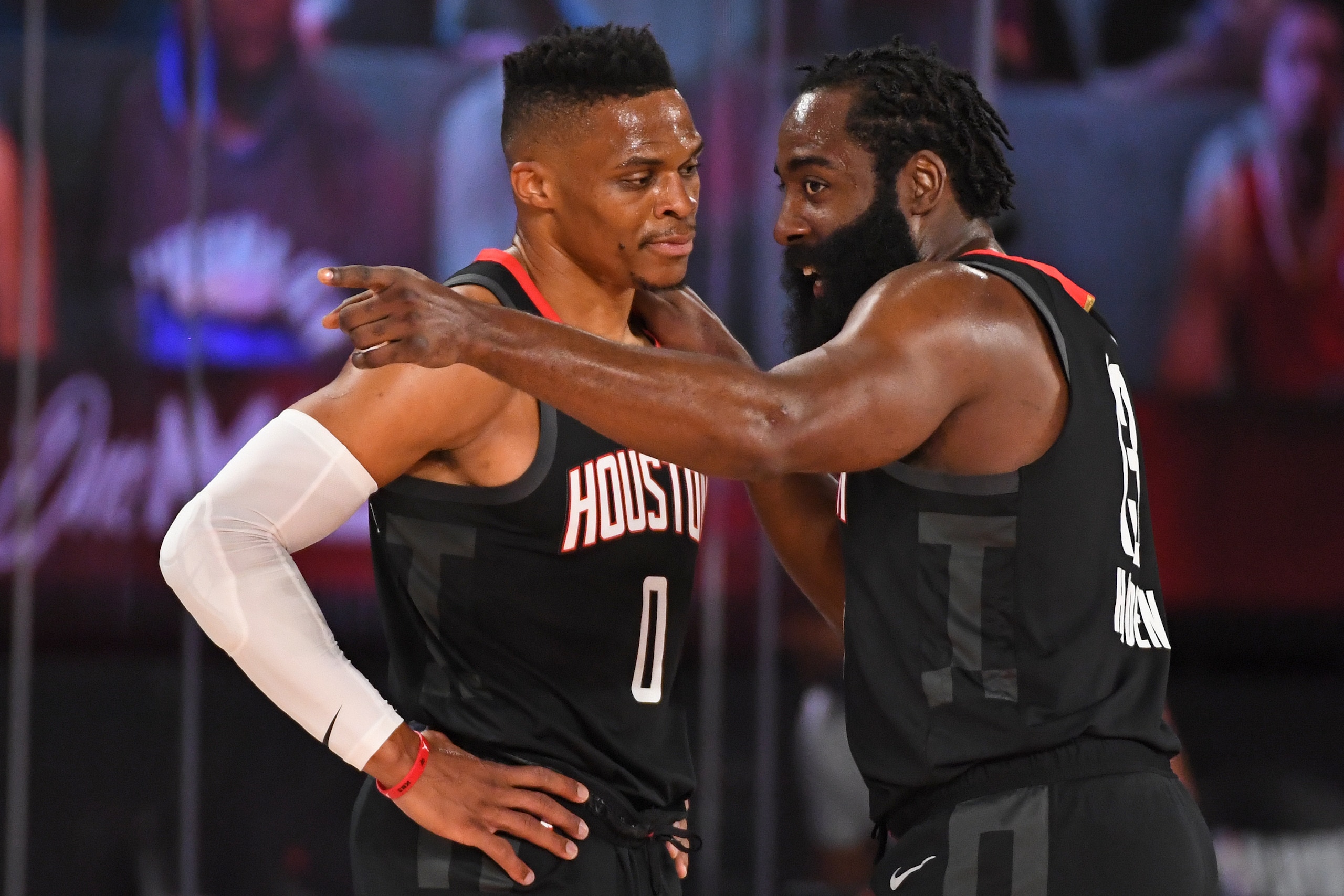Orlando, FL - AUGUST 29: James Harden #13 of the Houston Rockets and Russell Westbrook #0 of the Houston Rockets huddle up against the Oklahoma City Thunder during Round One, Game Five of the NBA Playoffs on August 29, 2020 in Orlando, Florida at The Fiel