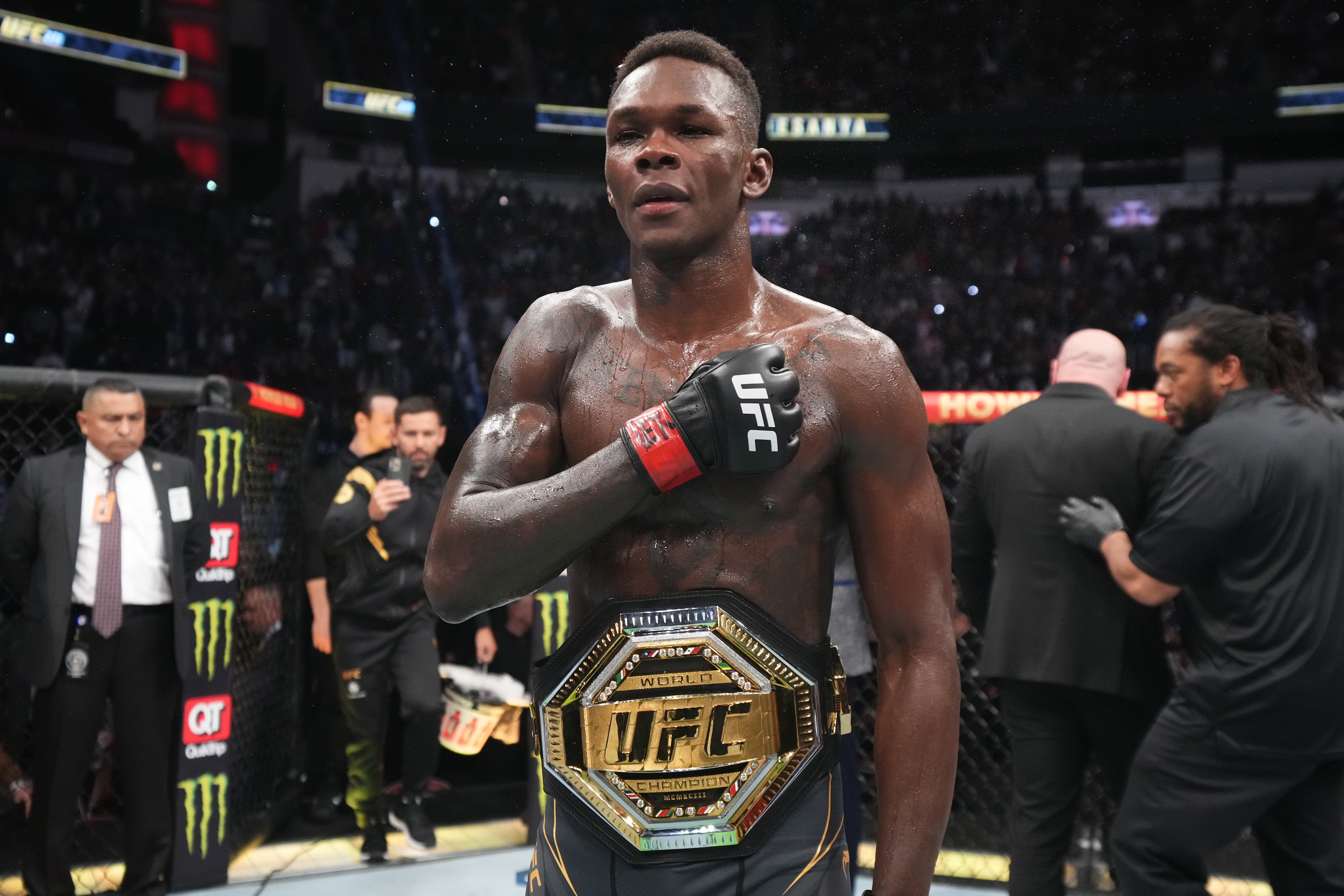 HOUSTON, TEXAS - FEBRUARY 12: Israel Adesanya of Nigeria reacts after defeating Robert Whittaker of Australia by unanimous decision in their UFC middleweight championship fight during the UFC 271 event at Toyota Center on February 12, 2022 in Houston, Tex