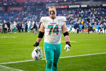 NASHVILLE, TENNESSEE - JANUARY 2:  Liam Eichenberg #74 of the Miami Dolphins walks off the field after a game against the Tennessee Titans at Nissan Stadium on January 2, 2022 in Nashville, Tennessee.  The Titans defeated the Dolphins 34-3.  (Photo by Wes