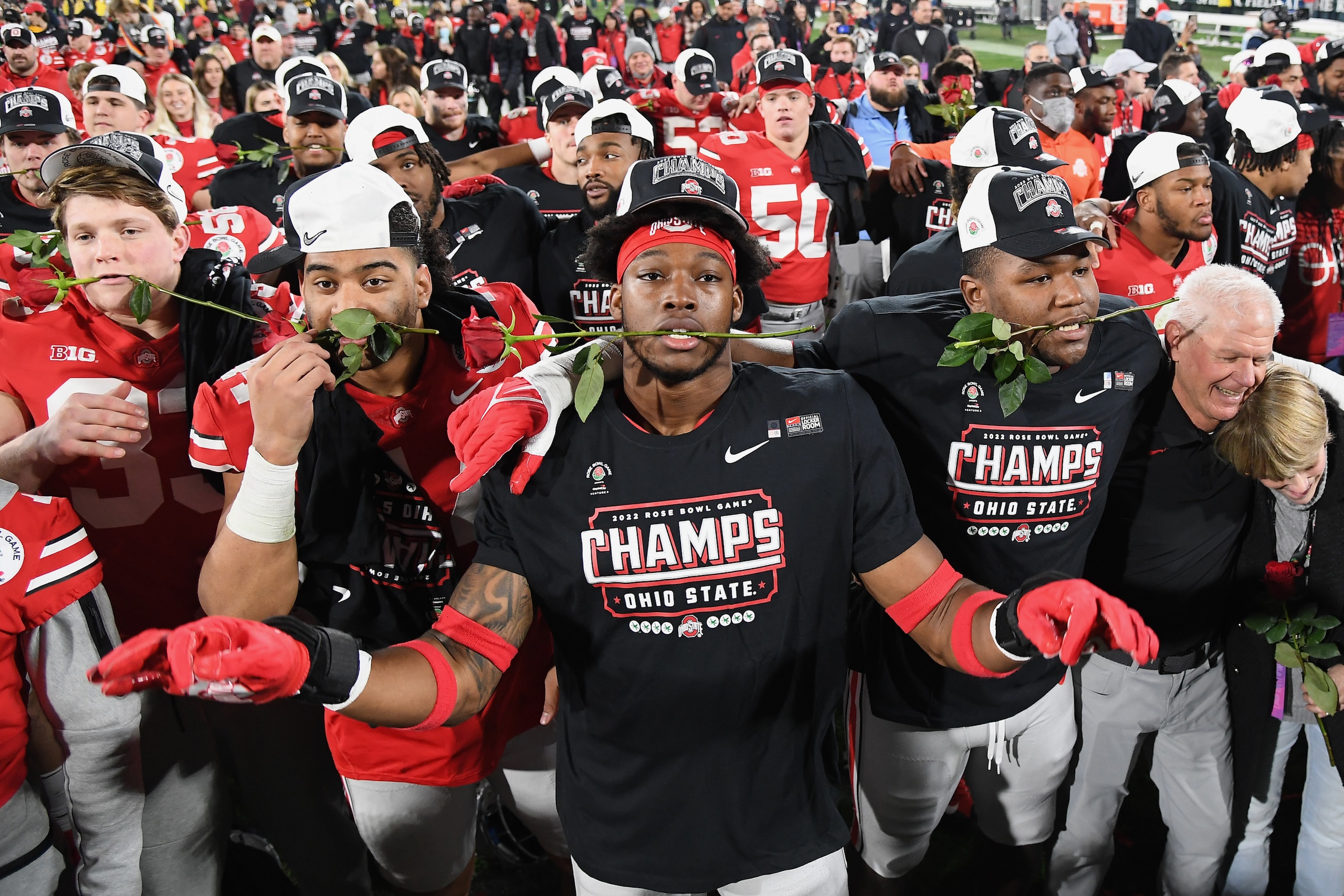 PASADENA, CA - JANUARY 01: Ohio State Buckeyes defensive end Javontae Jean-Baptiste (8) and his teammates celebrate on the field after the Buckeyes defeated the Utah Utes 48 to 45 to win the Rose Bowl game played on January 1, 2022 at the Rose Bowl in Pas