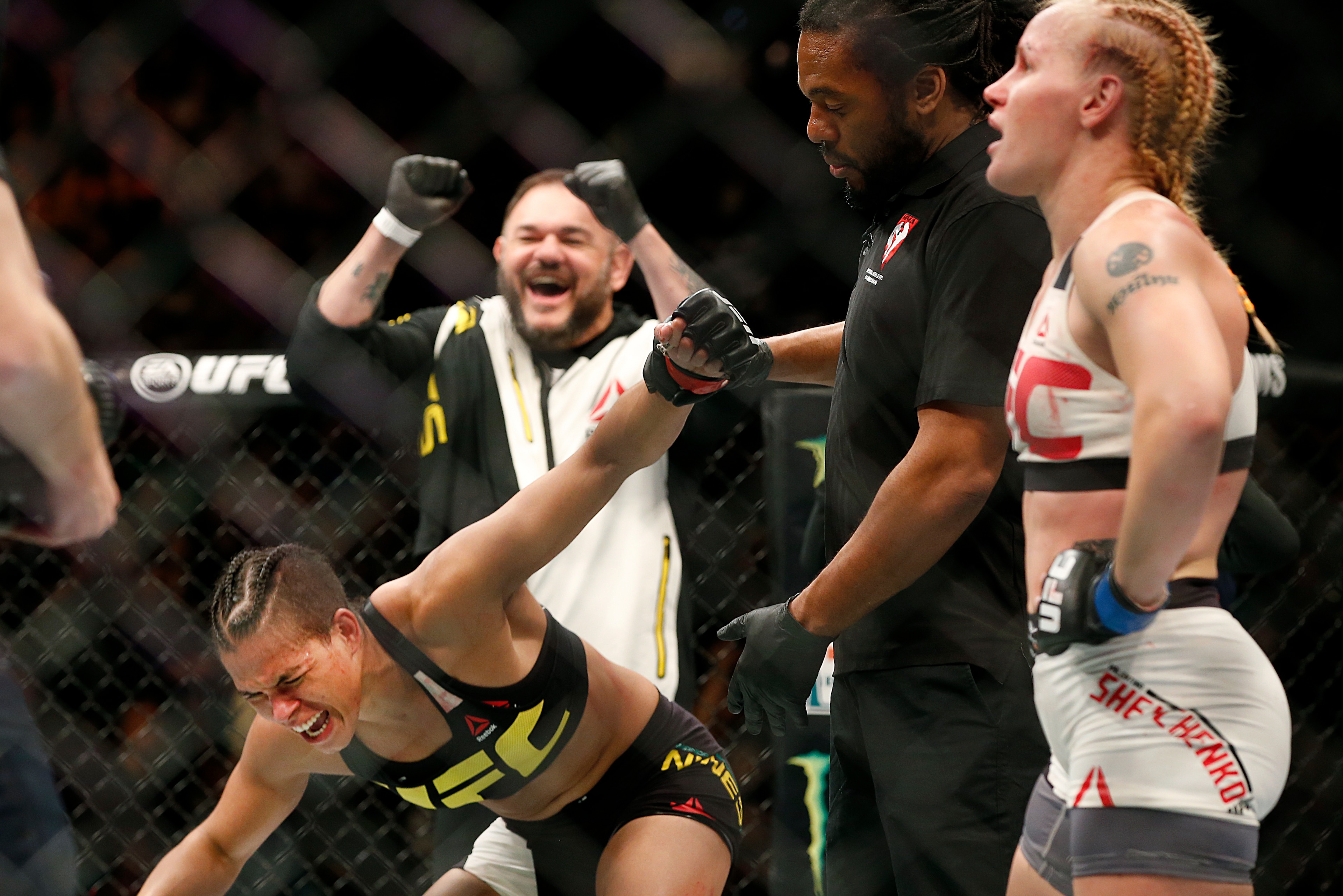 A stunned Shevchenko (right) after the decision is read for Nunes