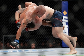 Covington (right) takes down Robbie Lawler